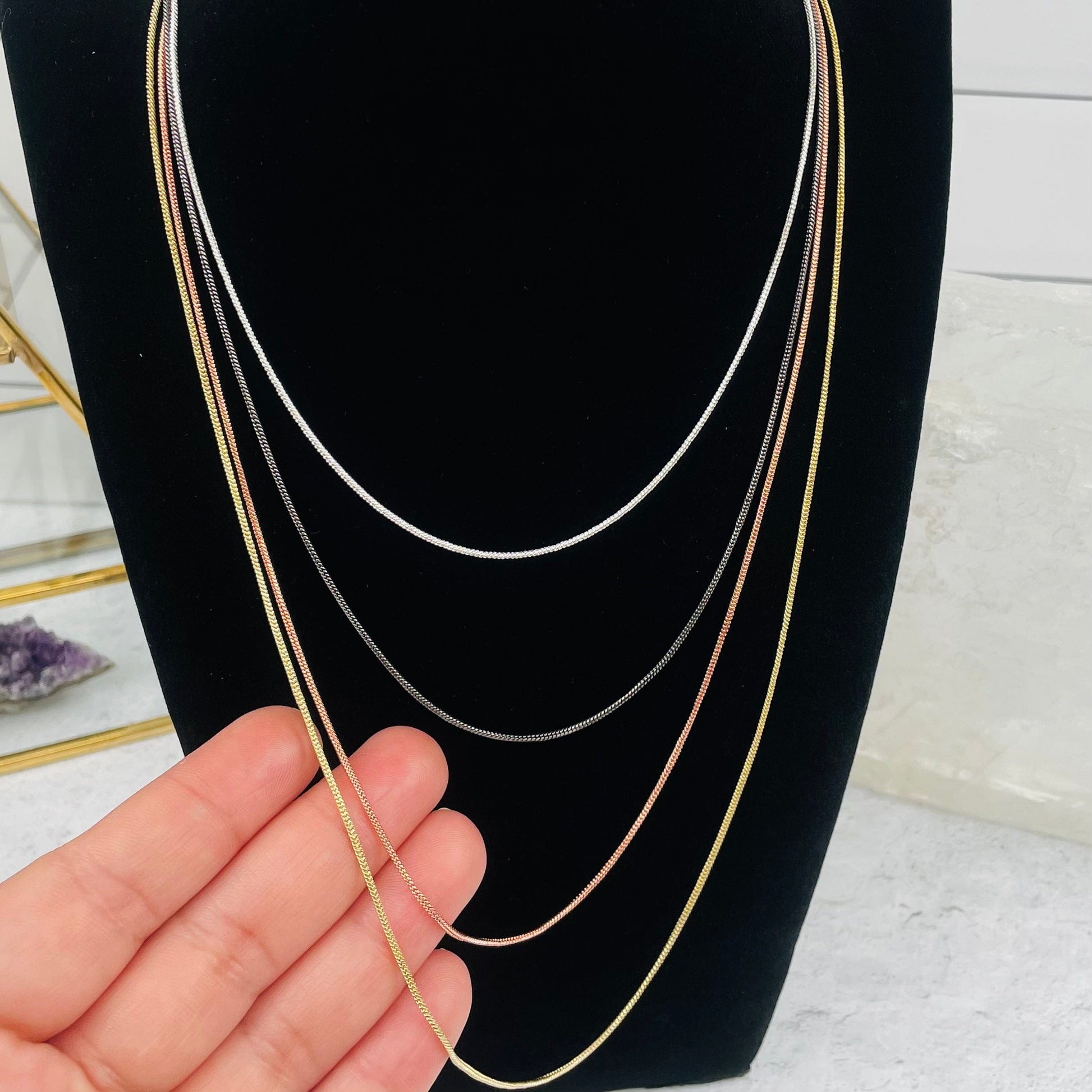Snake Chain Necklace in hand for size reference 