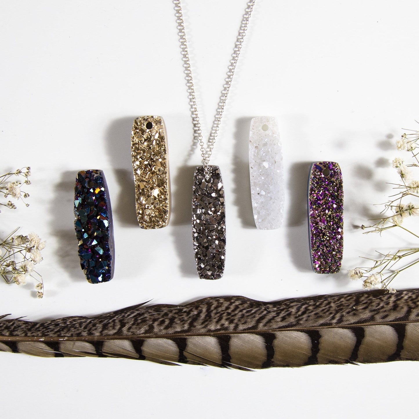 druzy bar drilled bead with decorations in the background