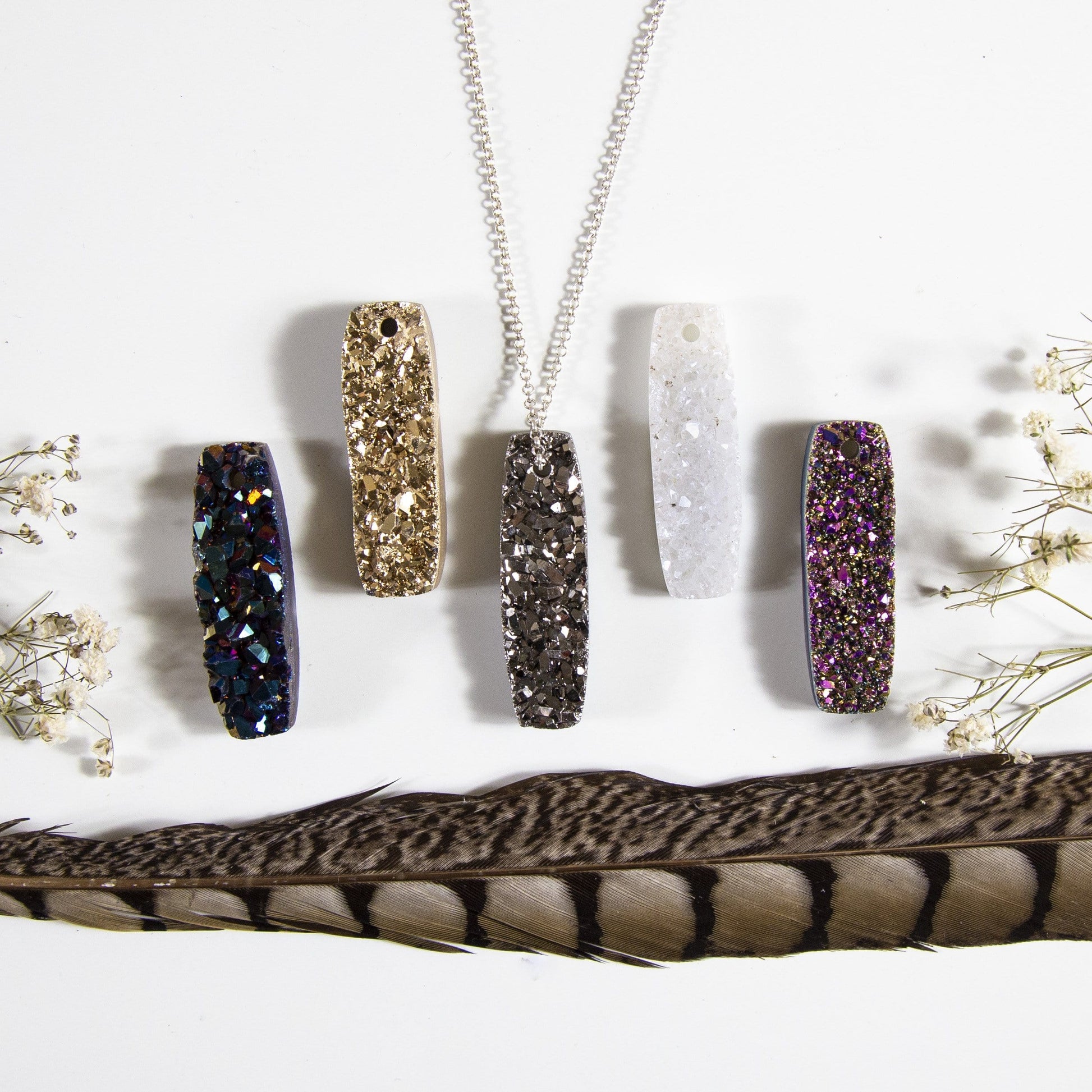 druzy bar drilled bead with decorations in the background
