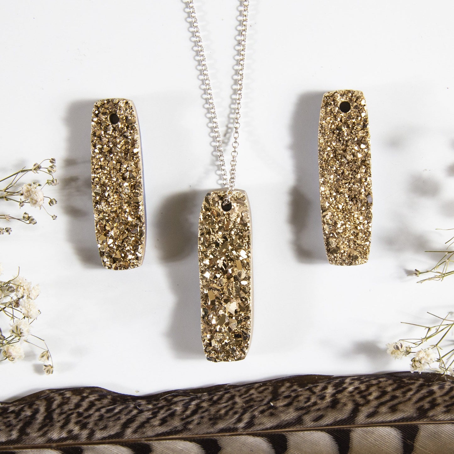 druzy drilled bead with decorations in the background