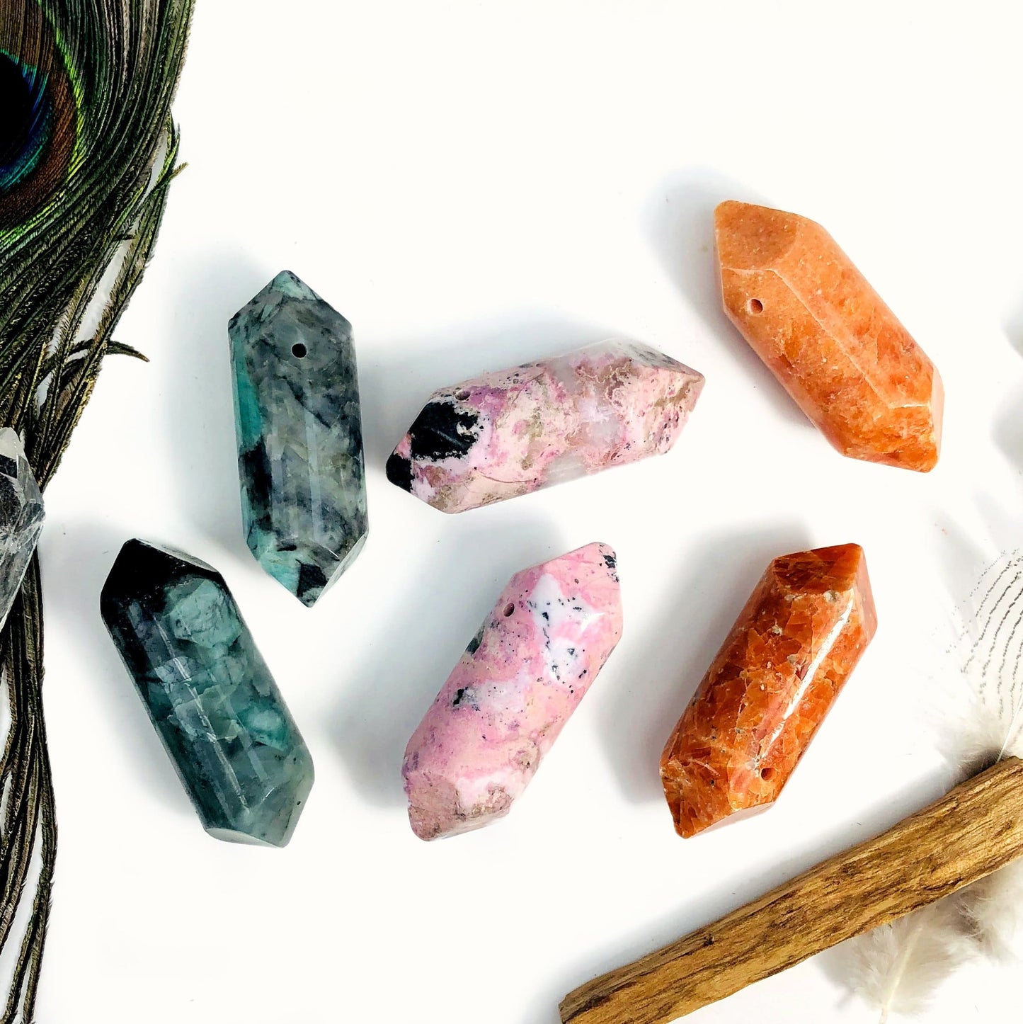 emerald rhodonite sunstone showing various characteristics and view of top driller hole