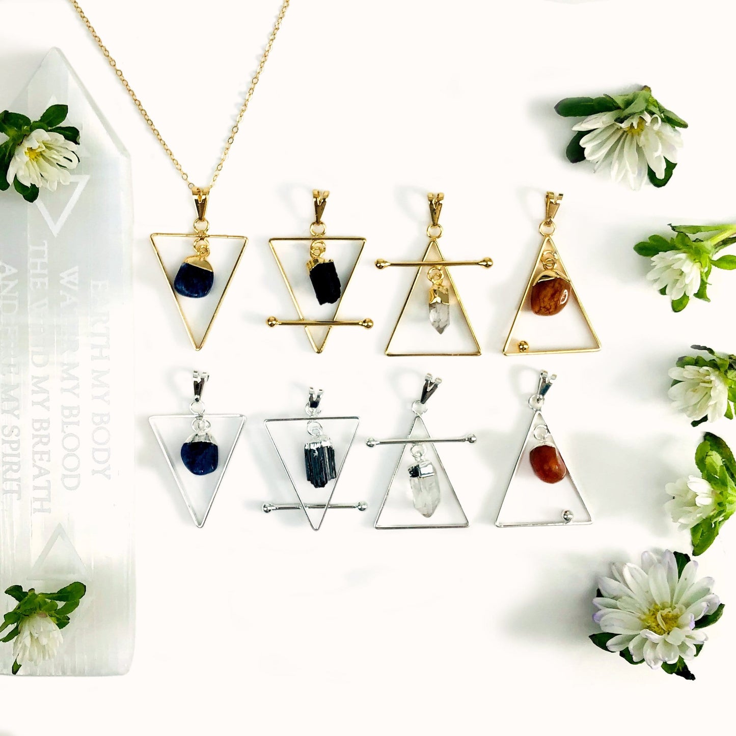 Gold Earth, Wind, Water, & Fire Element Pendants with a background