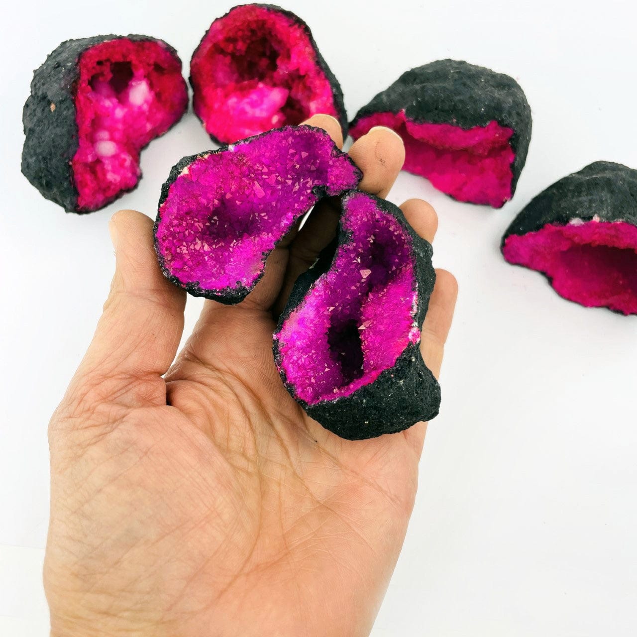 Hot Pink Color Dyed opened Geode in a hand