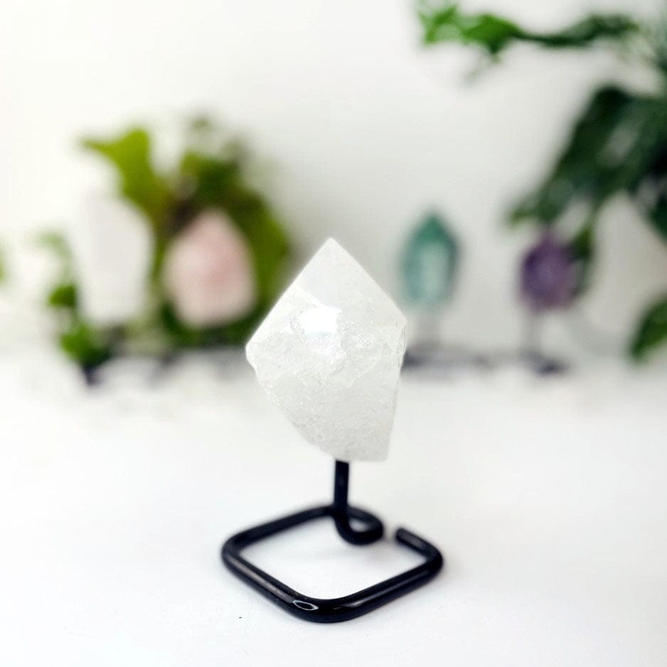 Semi Polished Points on Metal Stands up close of the crystal quartz
