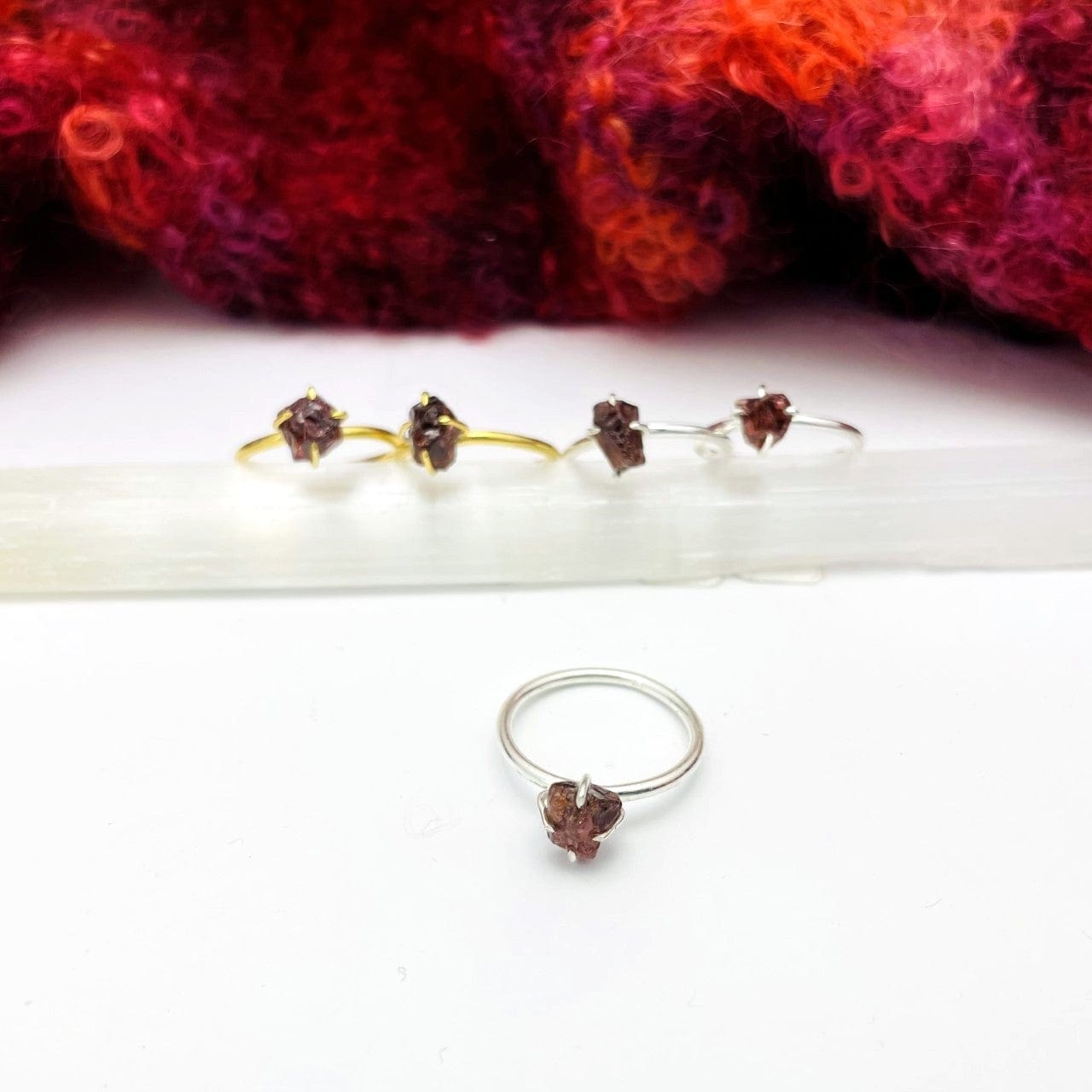 close up of the garnet gemstone rings. available in gold or silver 