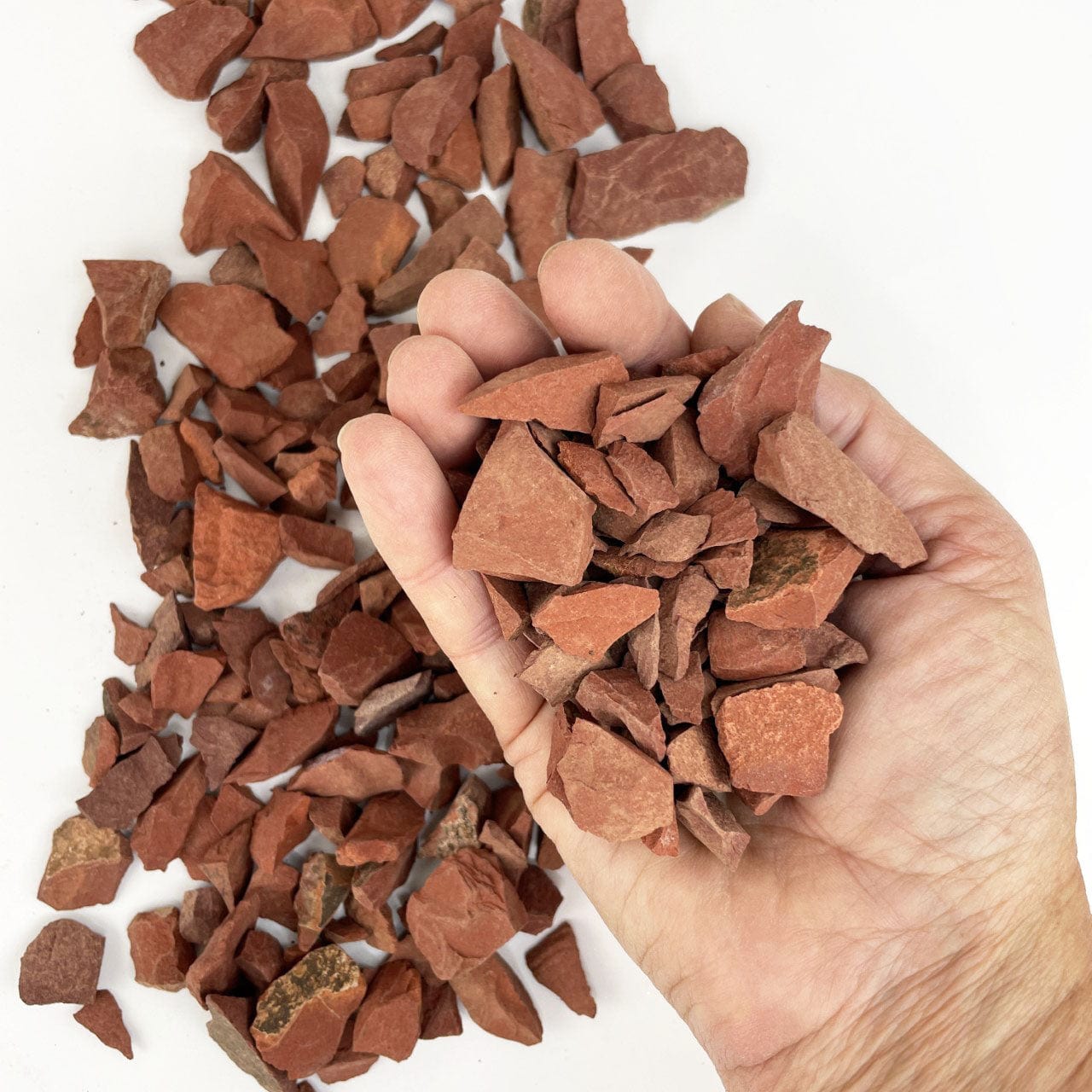 Red Jasper Stones in a hand