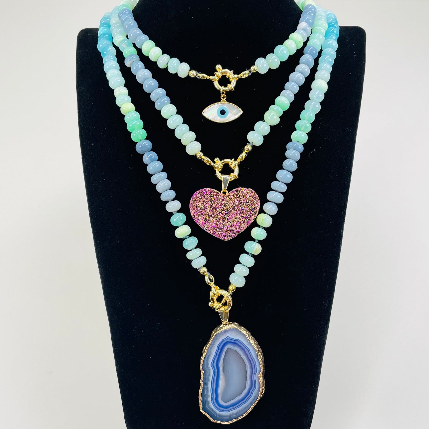 necklaces displayed with candy pendants 