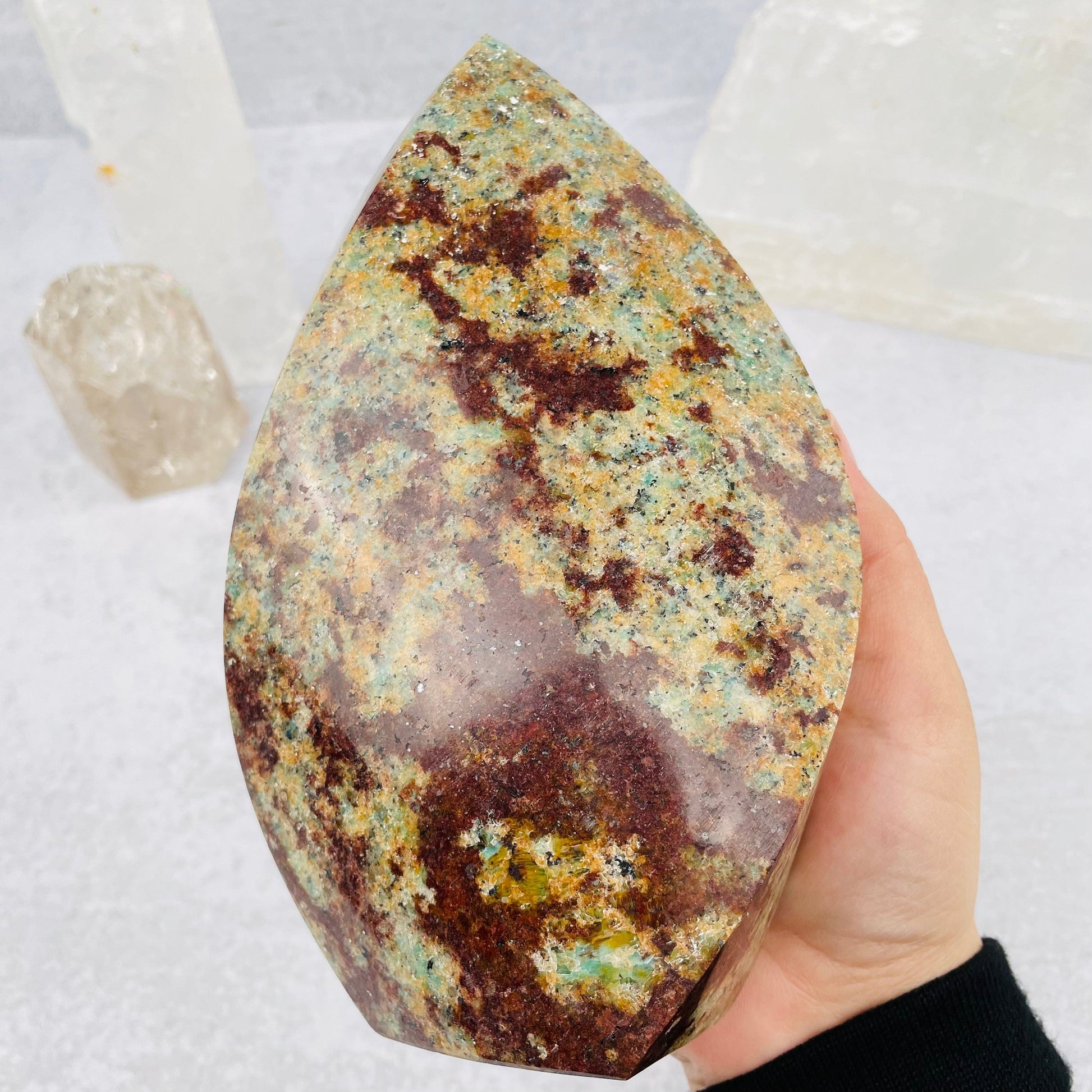 Amazonite Polished Flame tower in hand for size reference 
