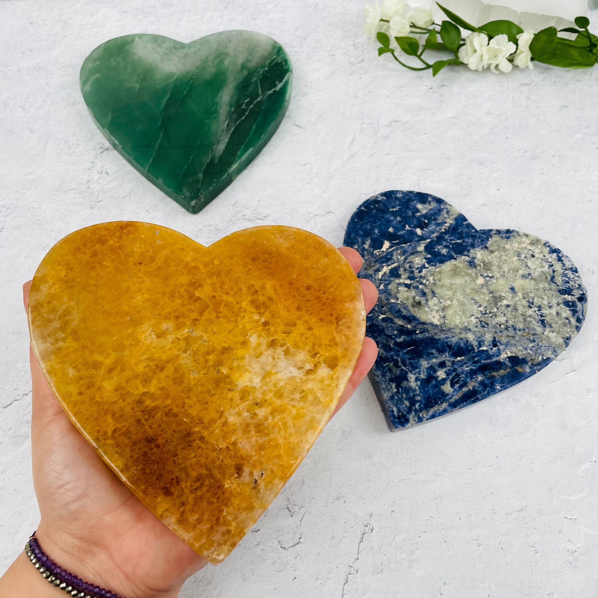 Gemstone Heart Slice in hand for size reference 