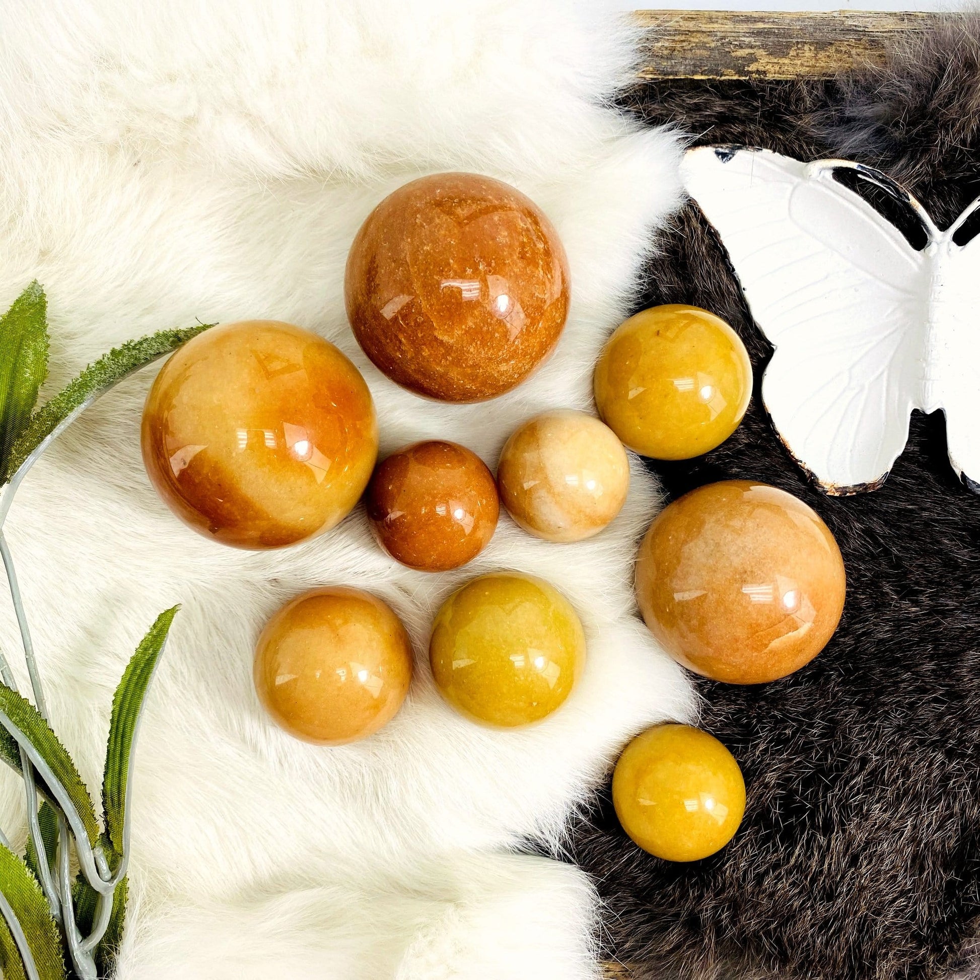 Peach Aventurine Polished Spheres top view with faux fur background top view