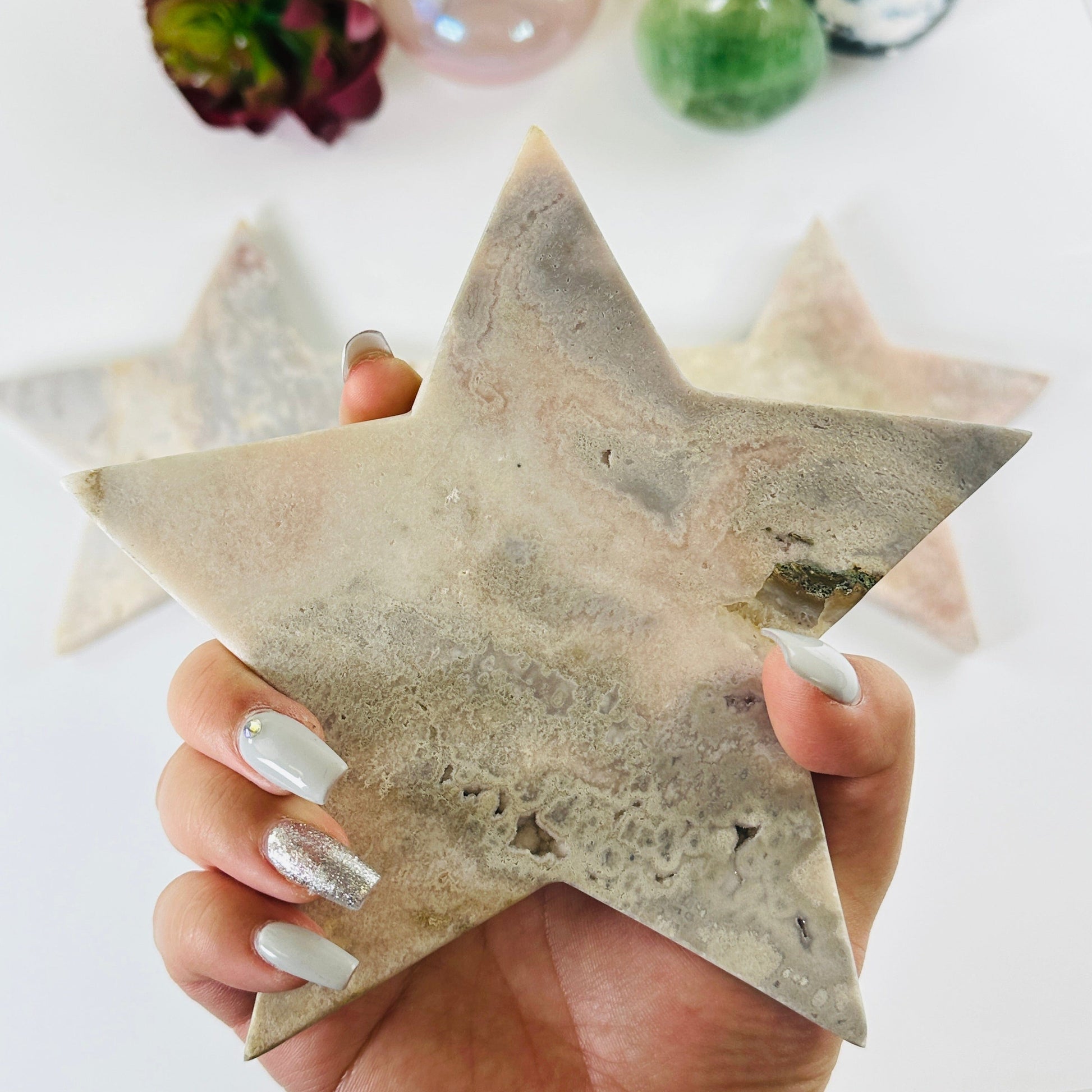 Pink Amethyst Large Crystal Star - You Choose variant 2 in hand for size reference with other variants in the background