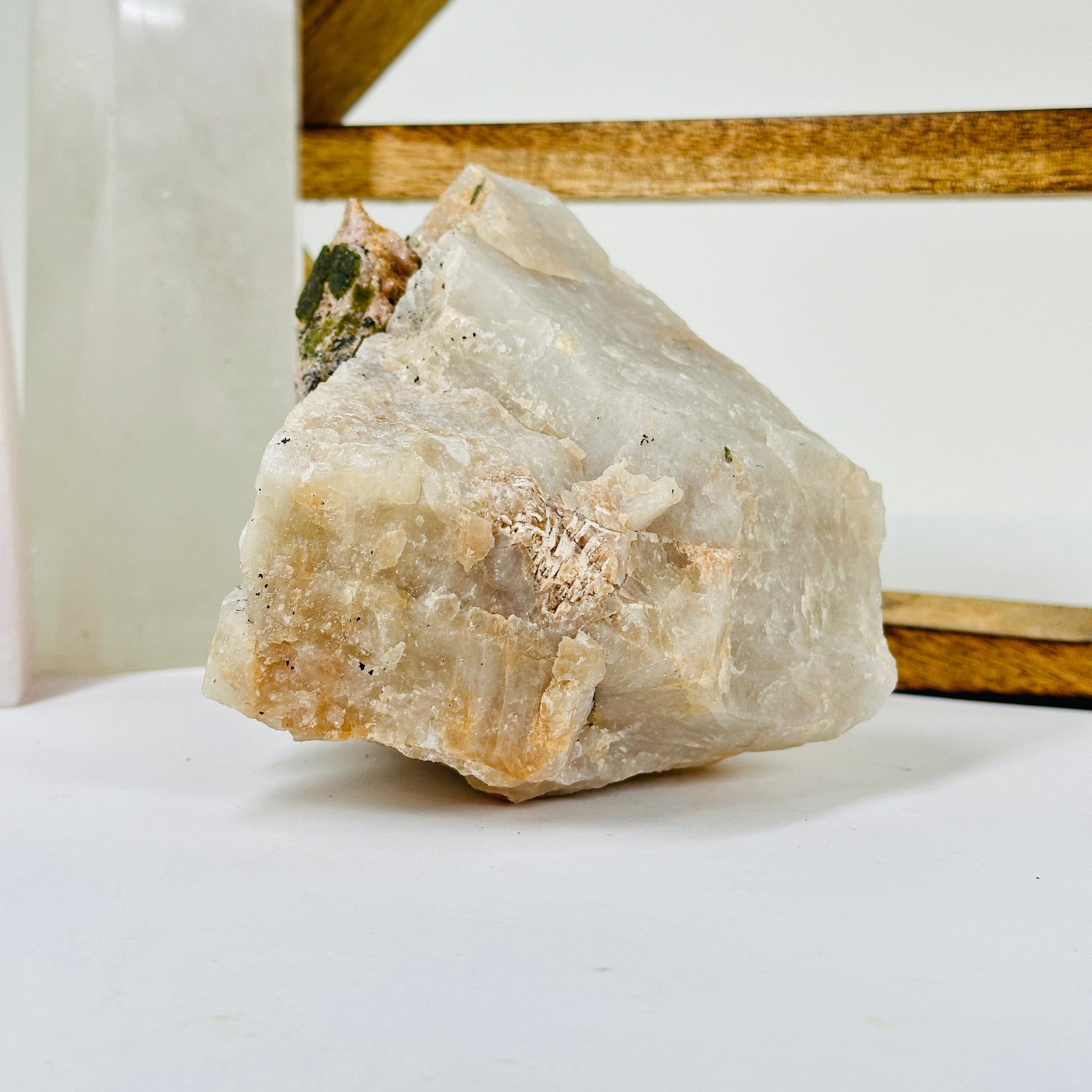 watermelon tourmaline with decorations in the background