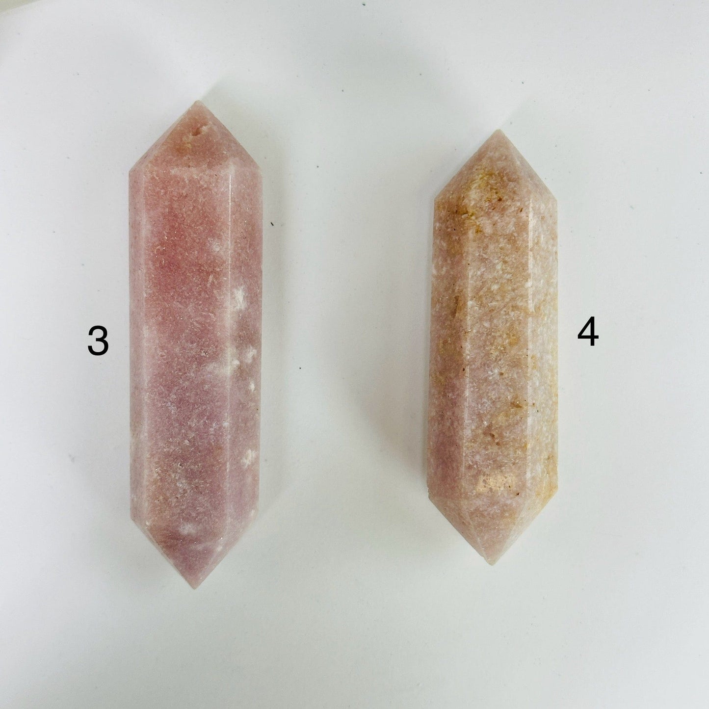 pink amethyst points with decorations in the background