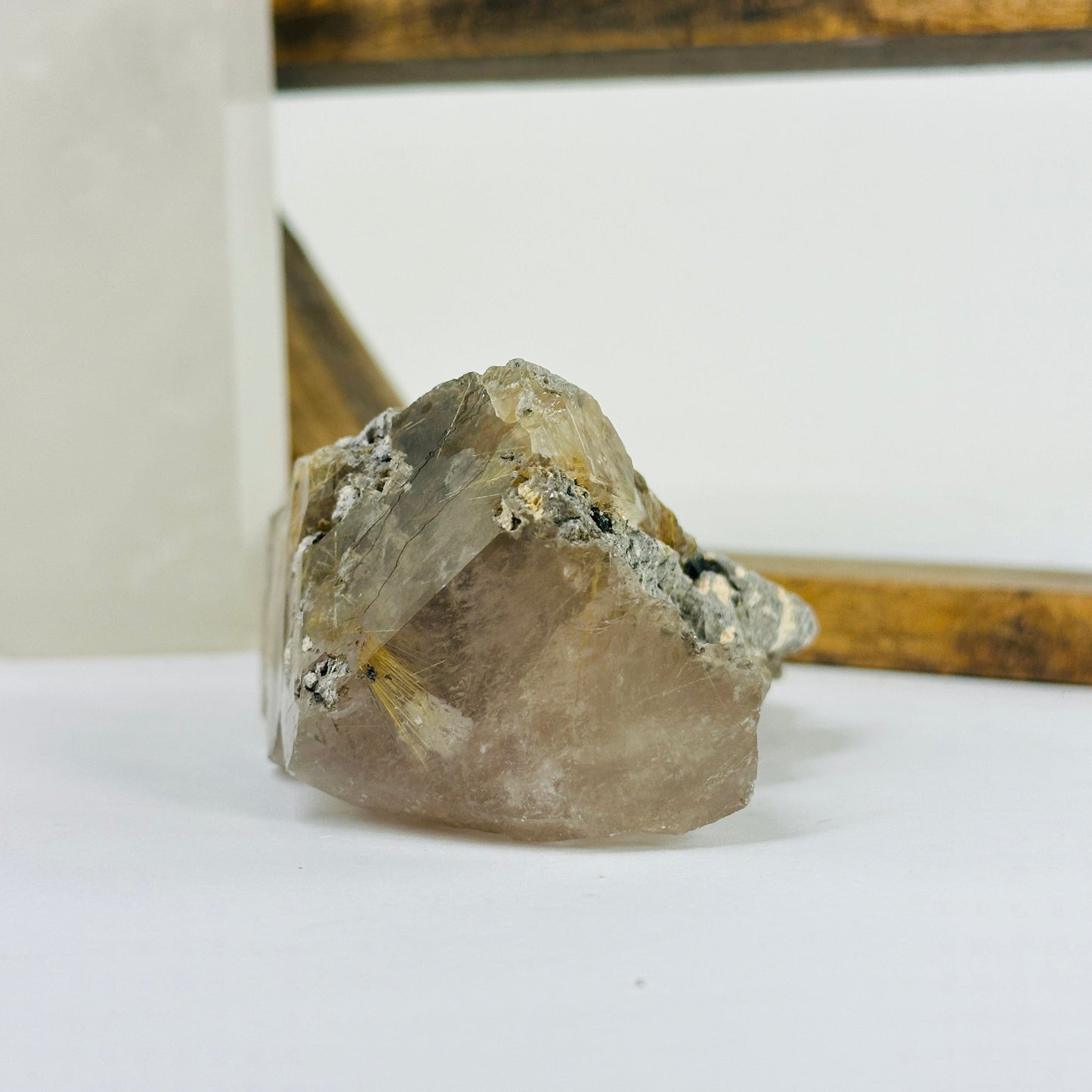 rutile quartz with decorations in the background