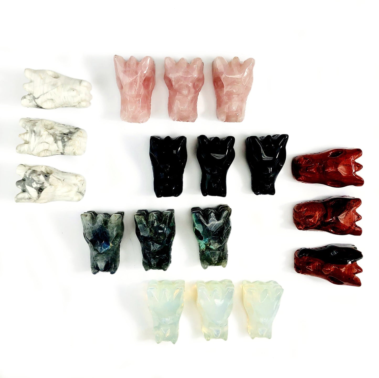 6 Different of Dragon Head Mini Statues on White Background.