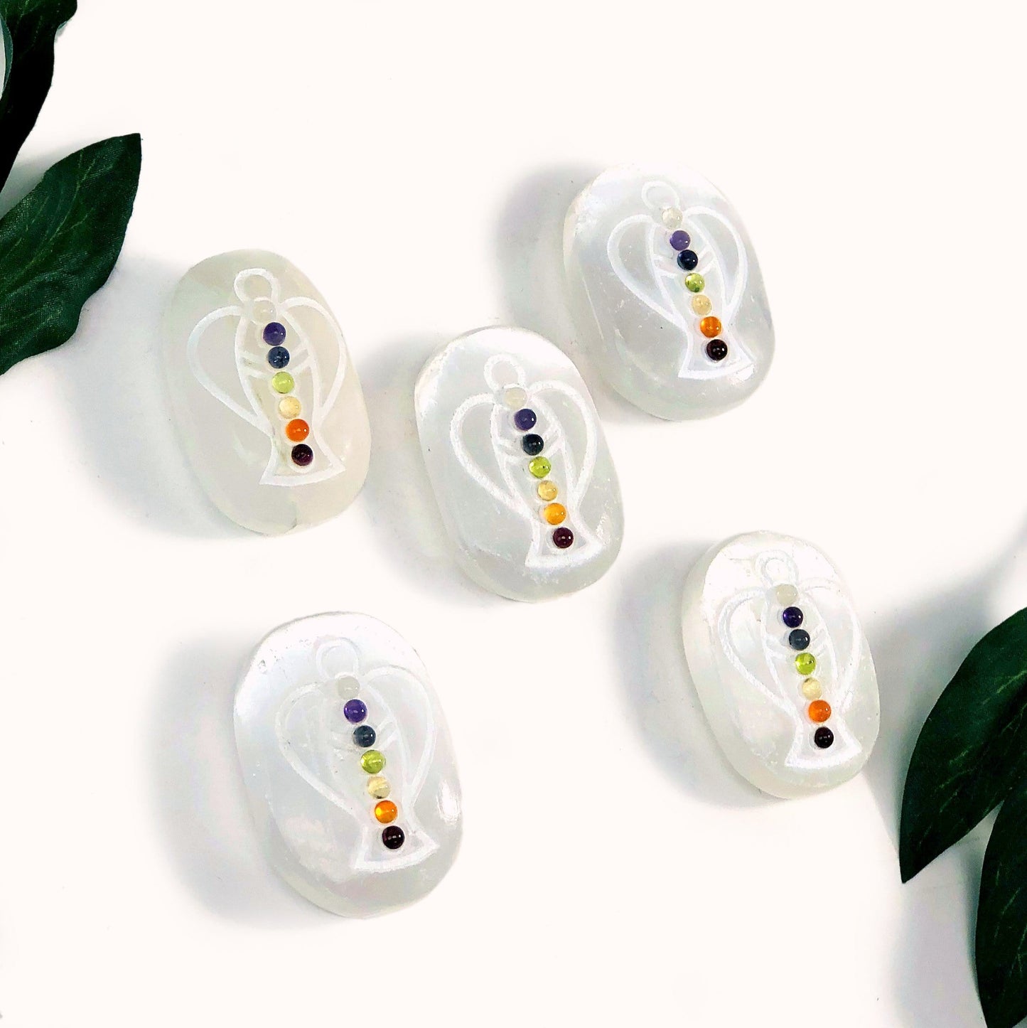 selenite palm stones on display for possible variations 