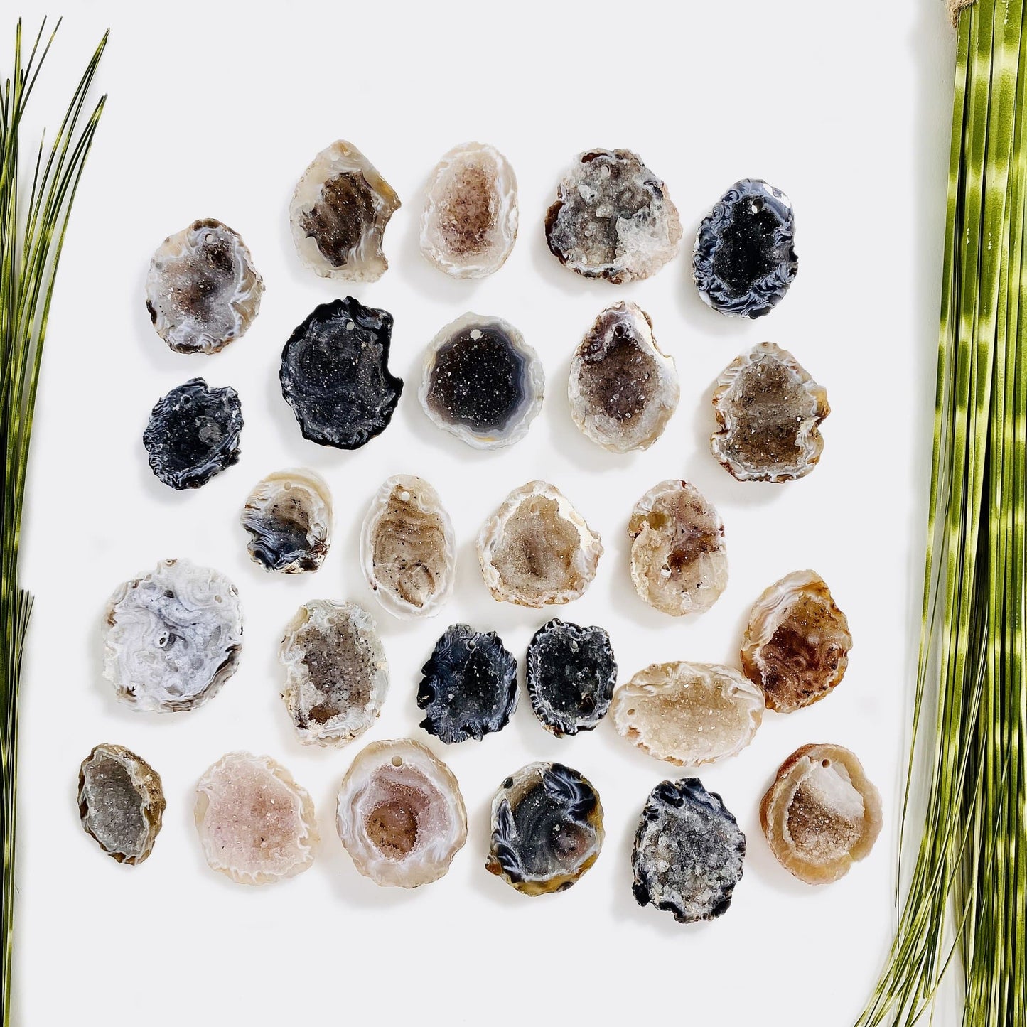 drilled druzy geodes on white background