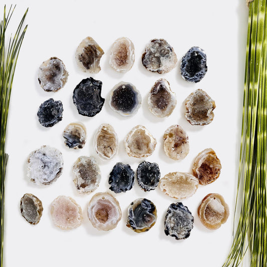 drilled druzy geodes on white background