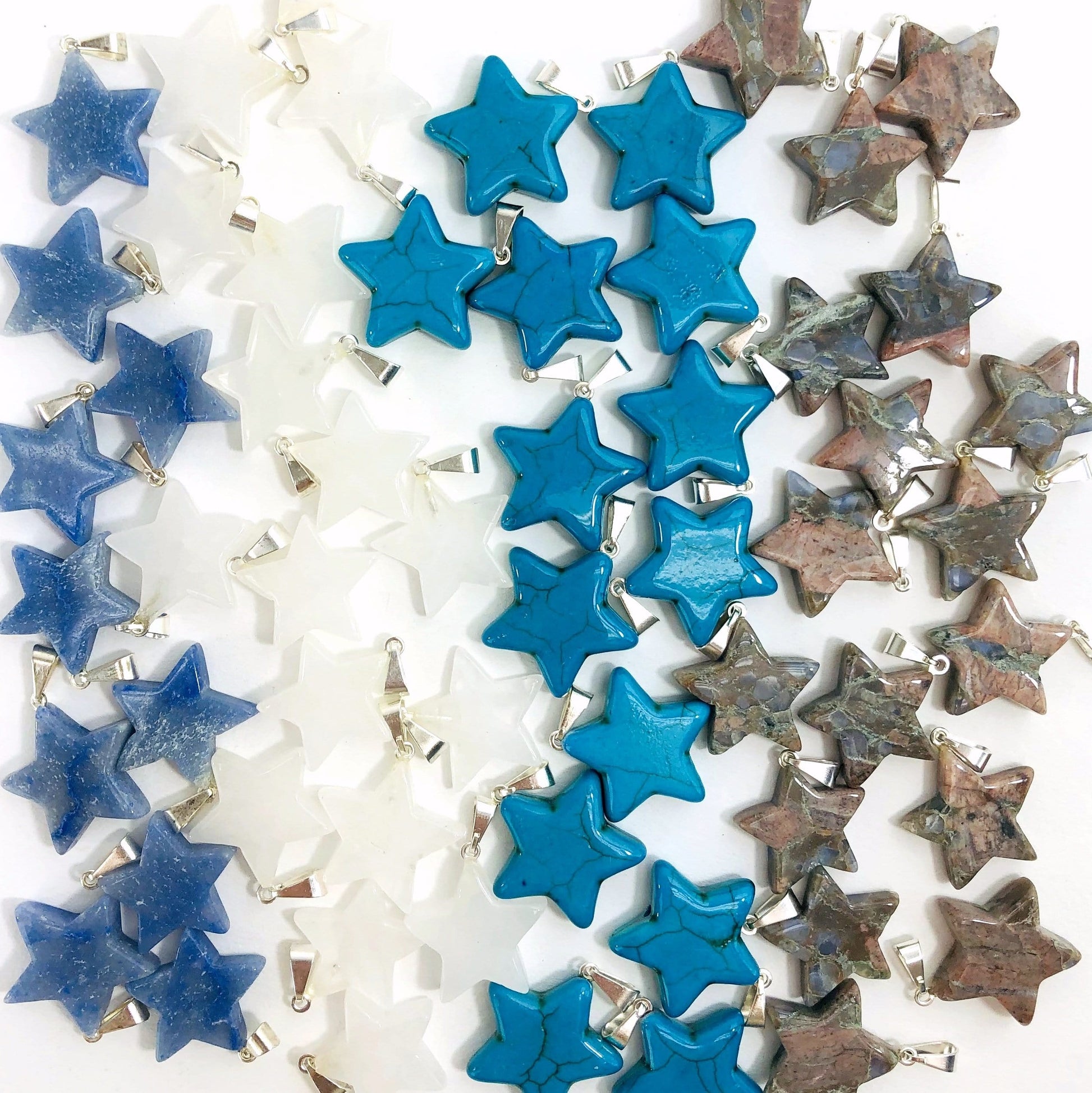 pendants available in blue quartz, crystal quartz, blue howlite and rhyolite 