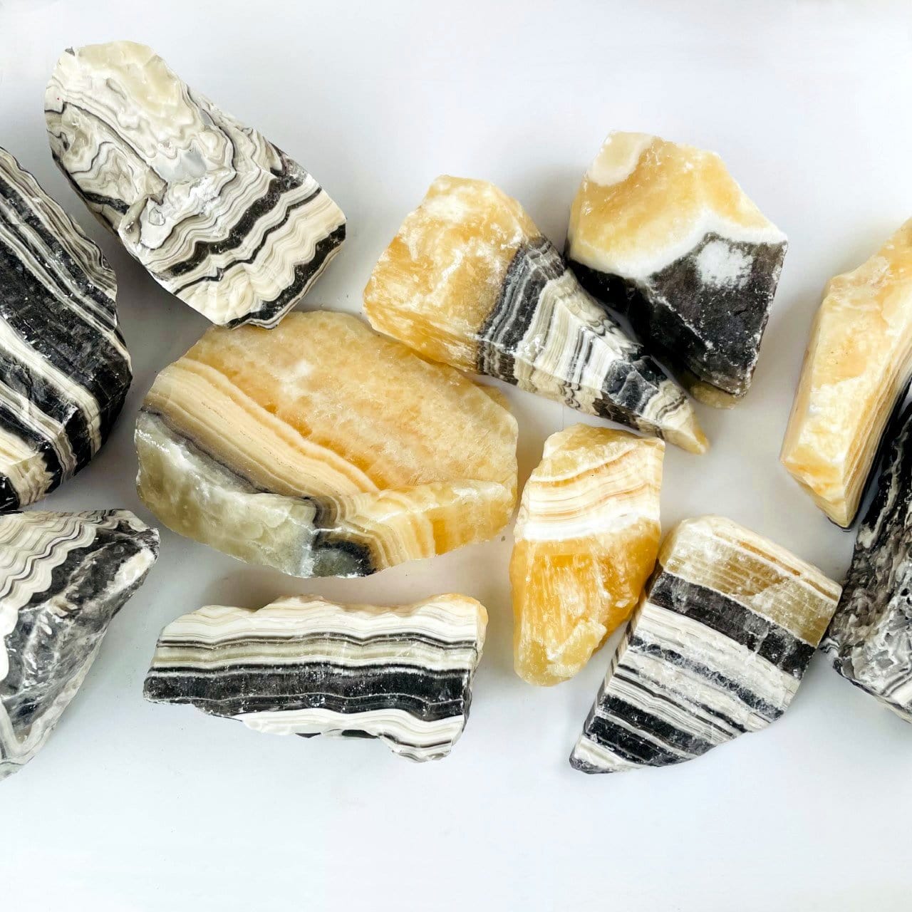 Up close view of 5 kilos worth of Mexican onyx laid out on a table as d.