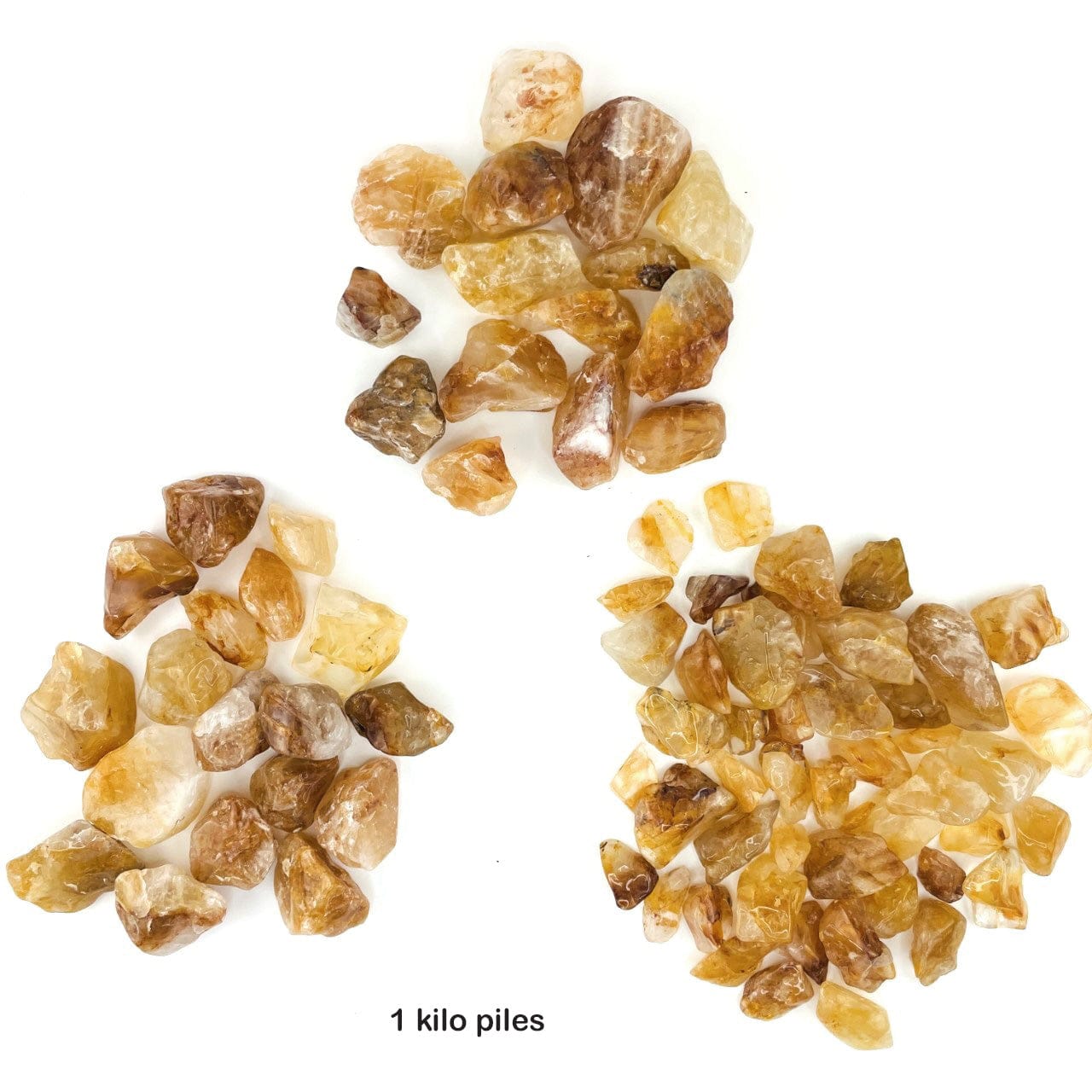 1 kilo piles of Golden Healer Quartz Polished Tumbled Stones