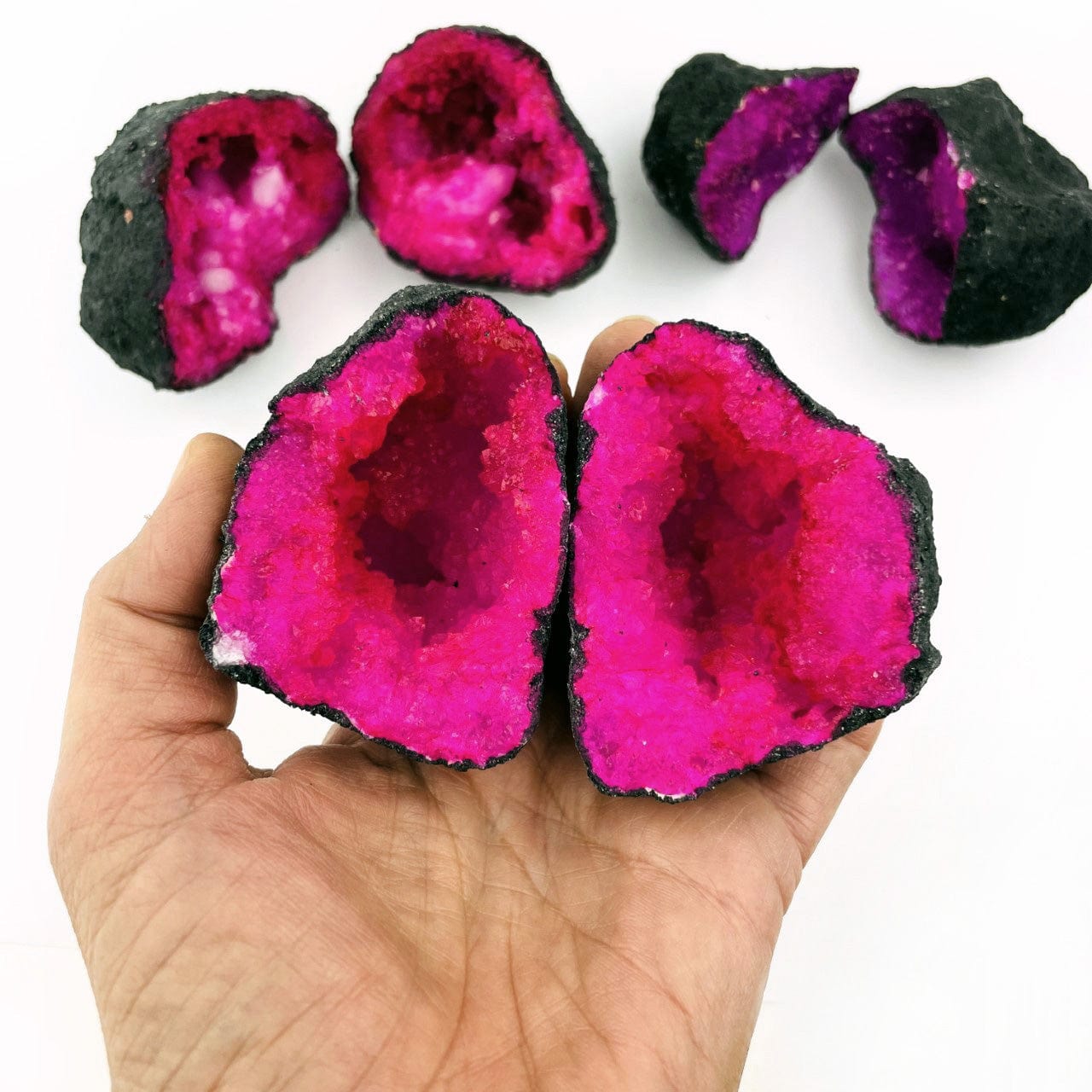 Hot Pink Color Dyed opened Geode in a hand