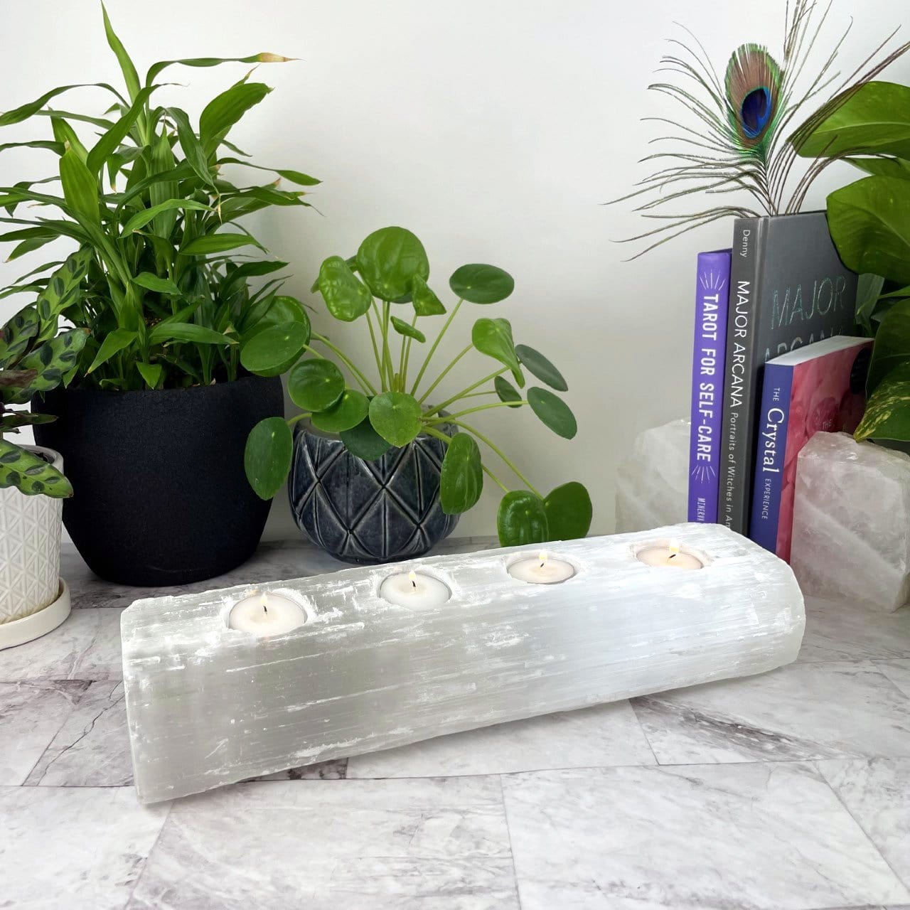 4 votive selenite candle holder on display