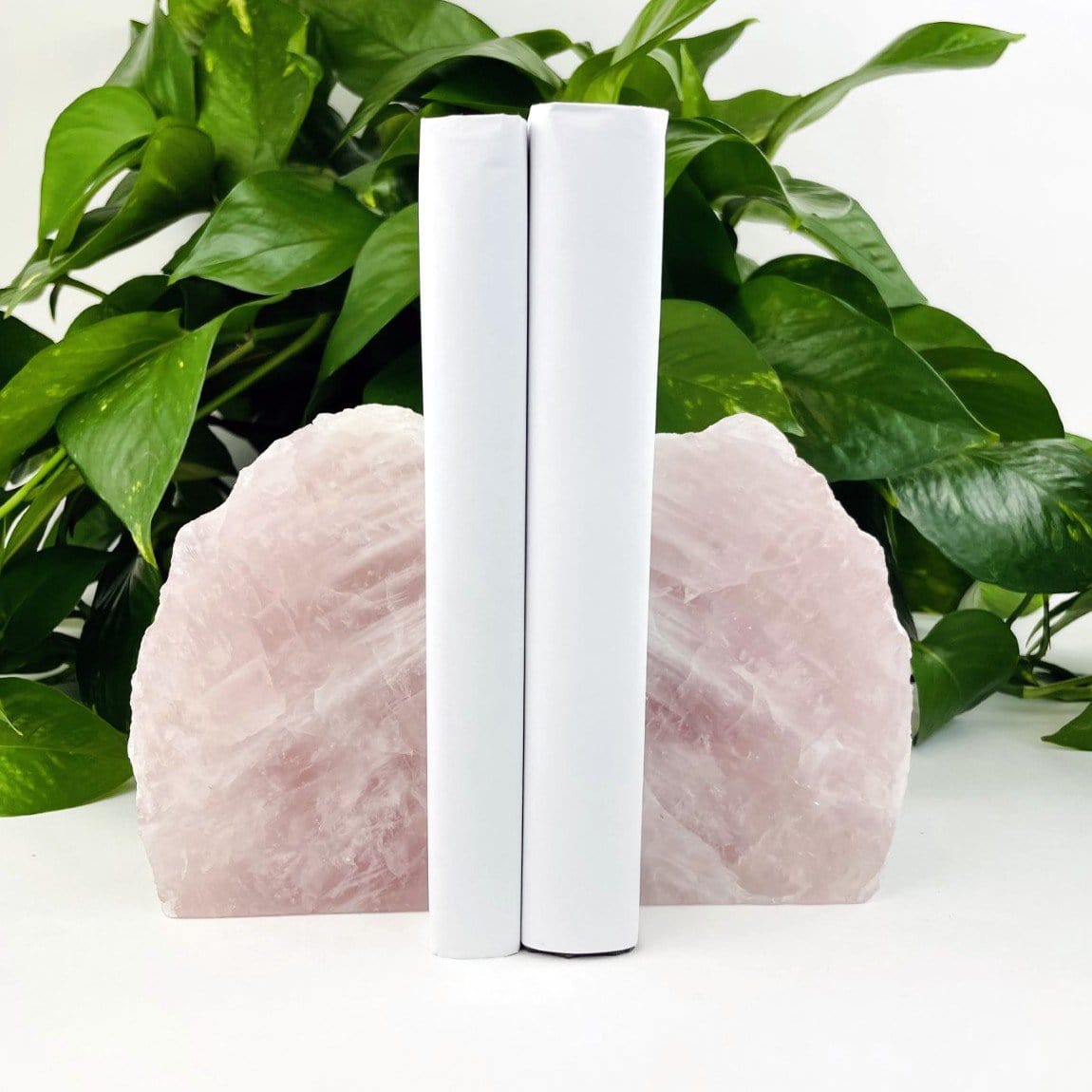 Rose Quartz Bookend Set - on a table