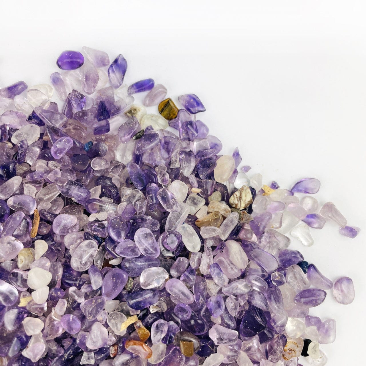 Amethyst Polished Small Chip Stones on a table up close