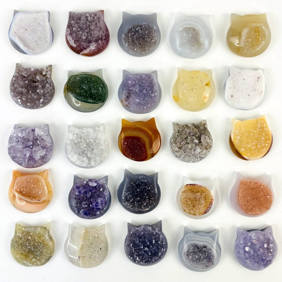 Multiple Agate Druzy Cat Heads on a white background to display color and pattern variation.