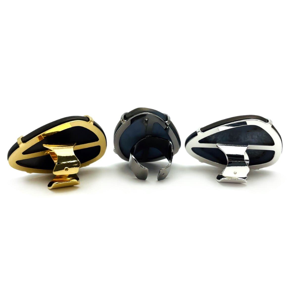 Backside view of three black druzy rings on a white background.