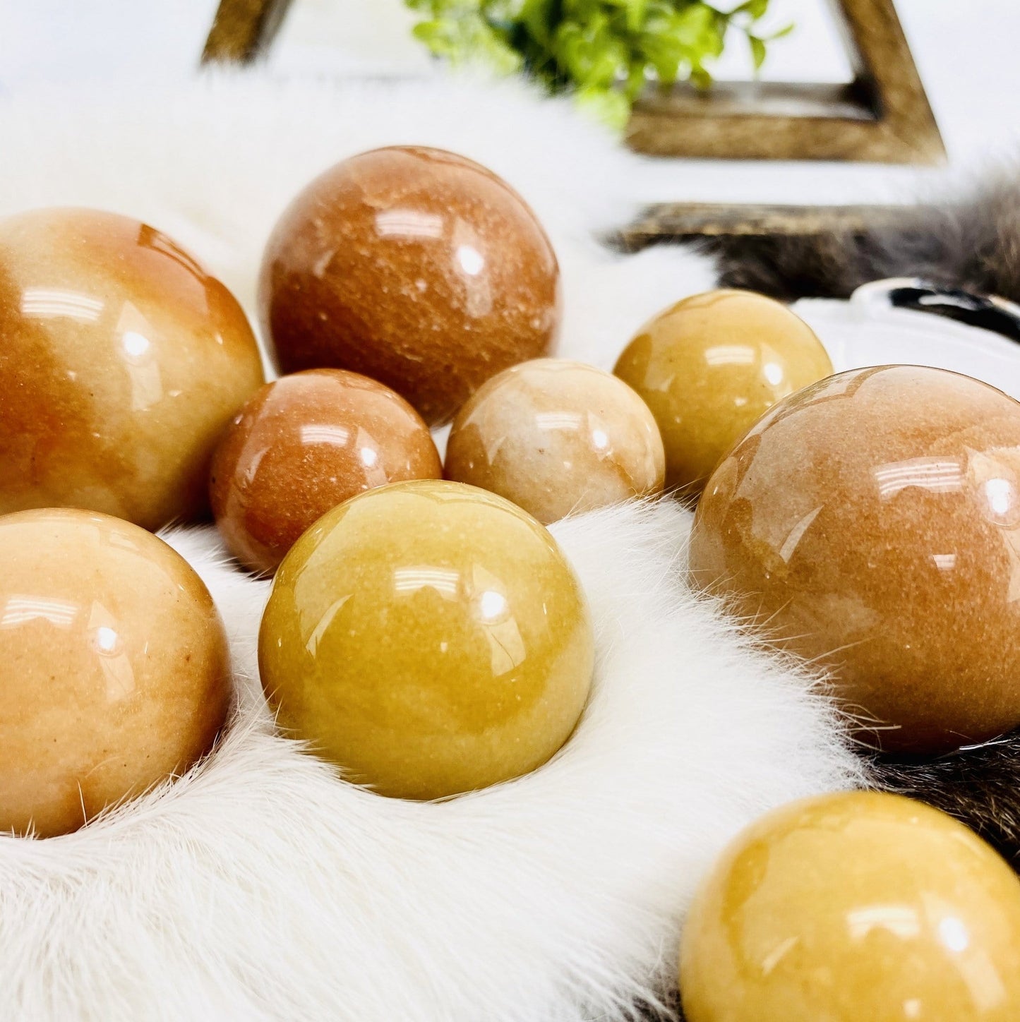 Peach Aventurine Polished Spheres on faux fur front view