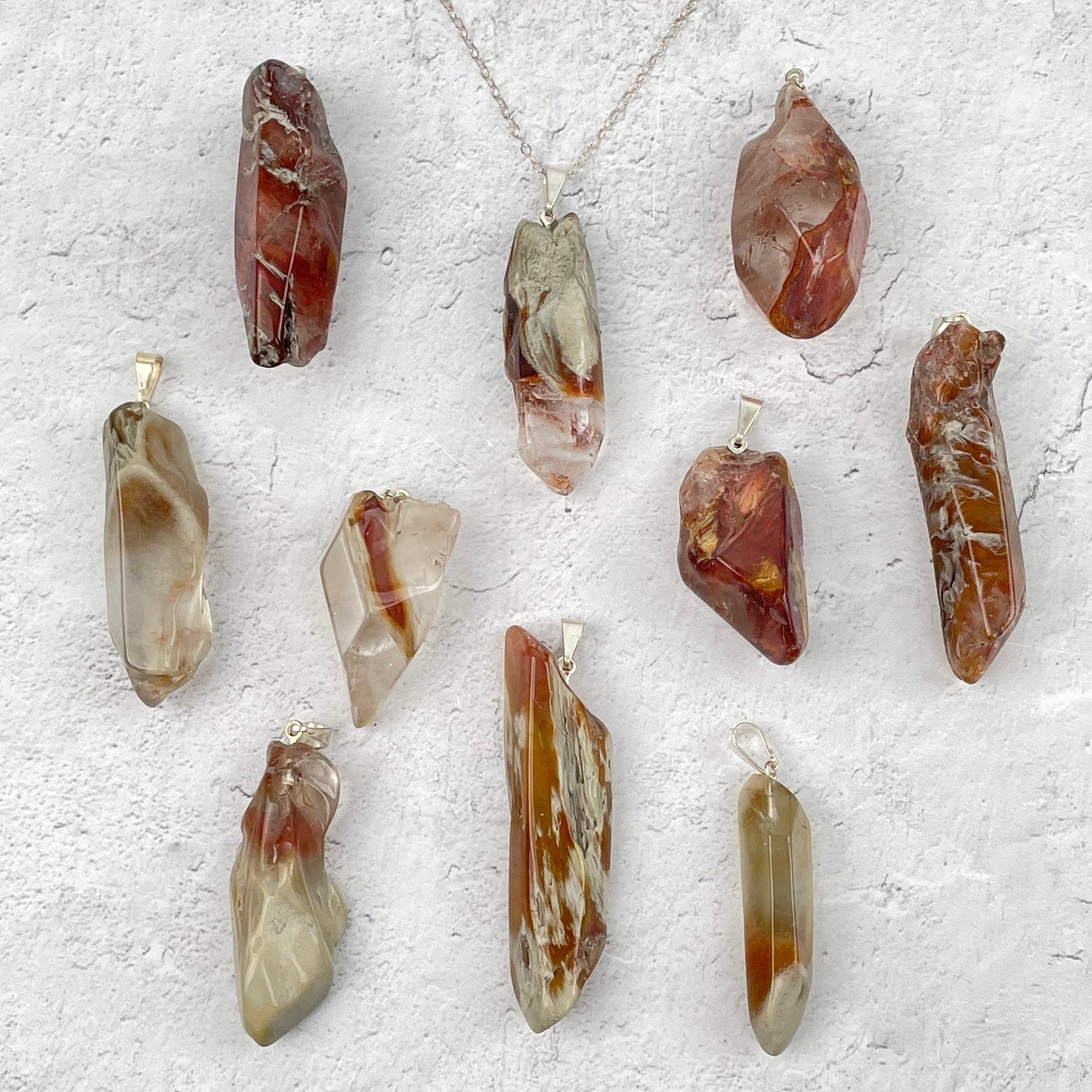 multiple pendants displayed to show the differences in the color shades and sizes 