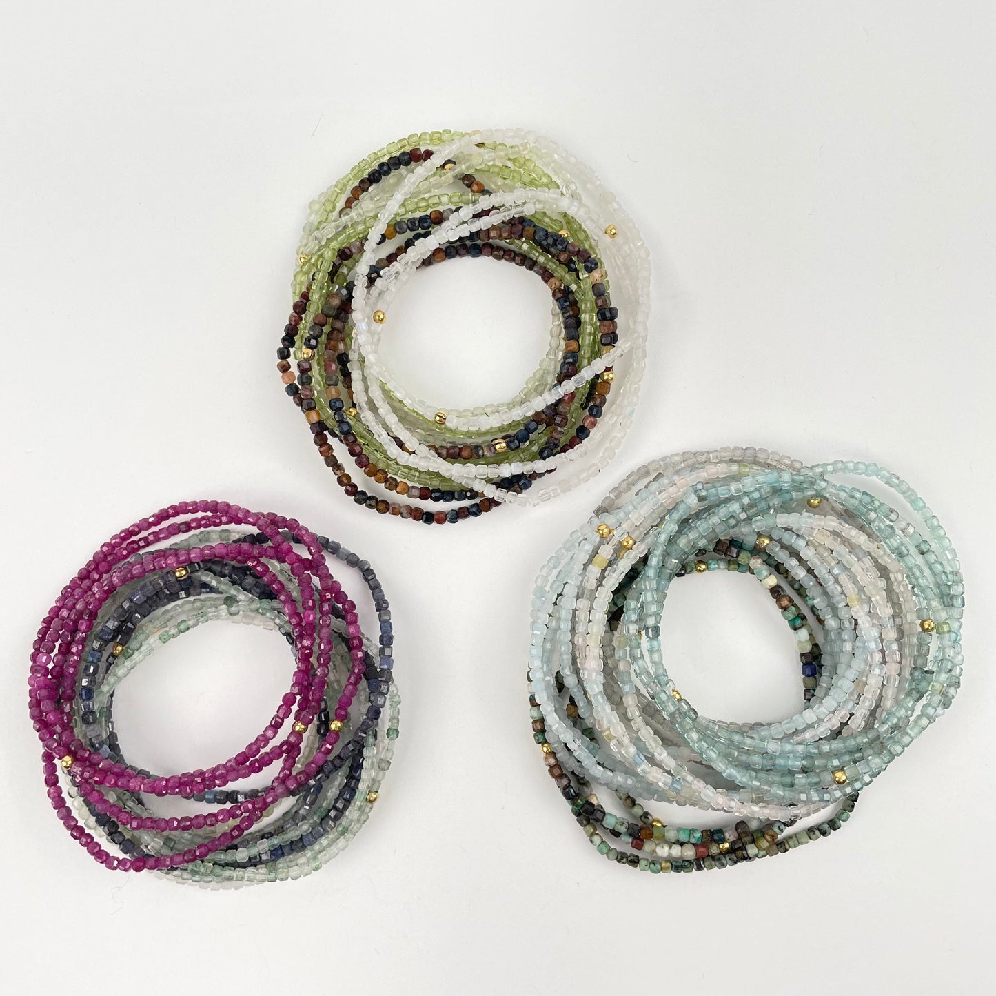 multiple bracelets showing the difference crystal types 