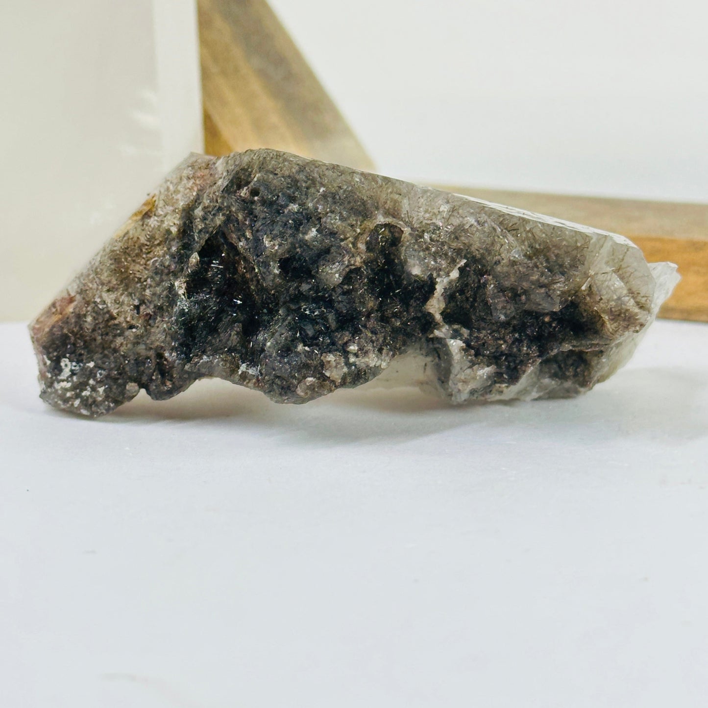 rutile quartz with decorations in the background