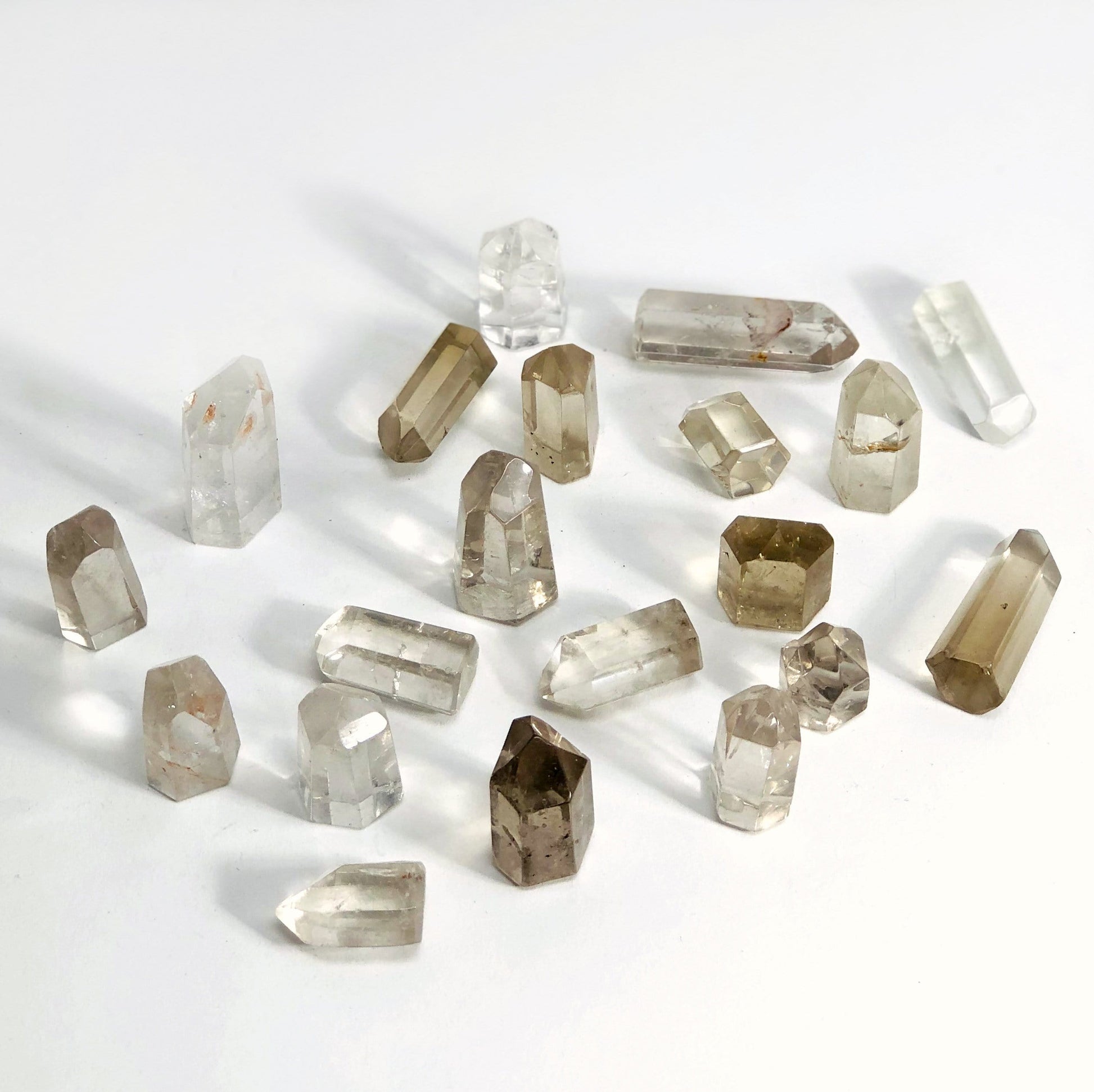 Crystal Quartz Polished Points spread out showing range of stock available