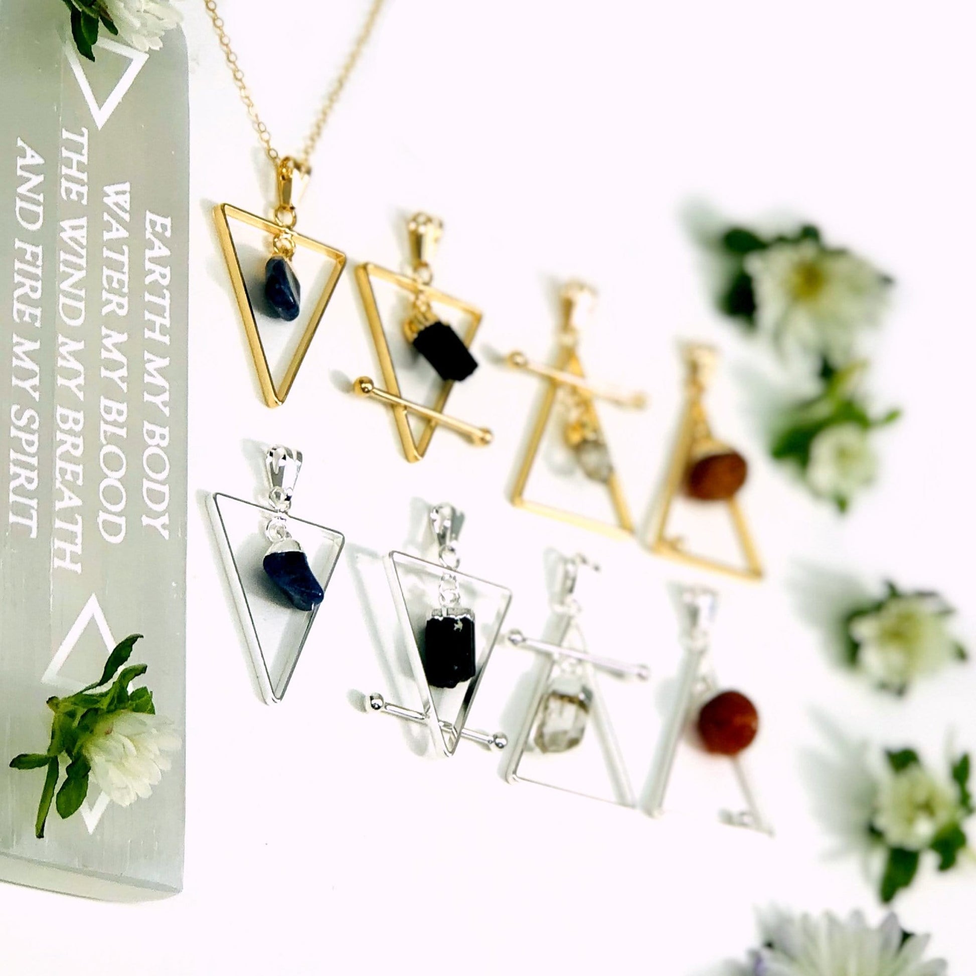 All the Gold and Silver element pendants in assorted colors line up