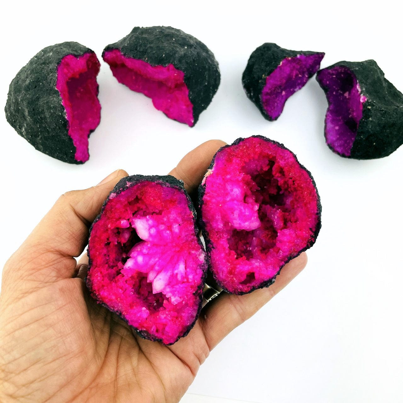Hot Pink Color Dyed opened Geode in a hand