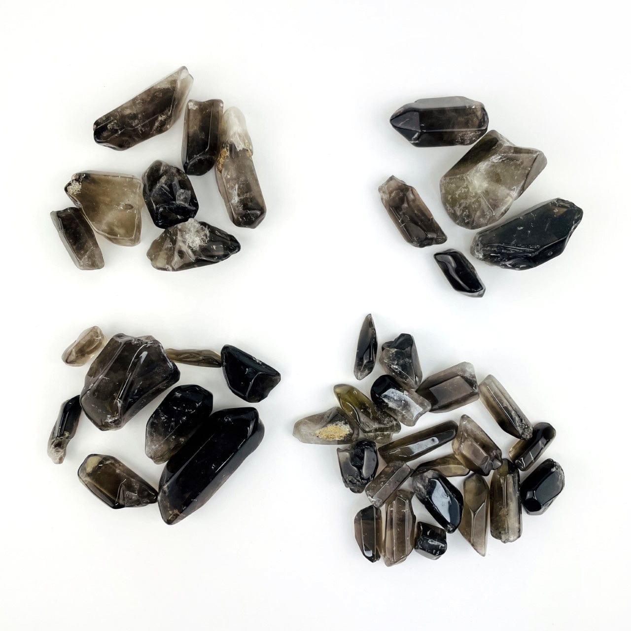 4 piles of polished Smoky Quartz Tumbled Stones and Points, each pile 1/2 pound