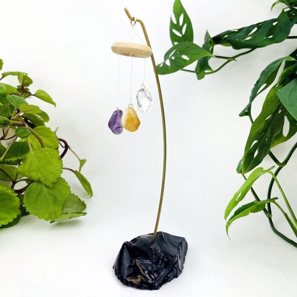 Black Obsidian Base with Quartz, Citrine and Amethyst Polished Stones displayed up close