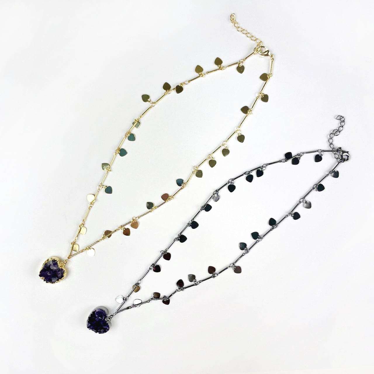 Amethyst Druzy Heart on Sweetheart Necklace with Heart Dangle Chain in  Gold and Gunmetal on a white table