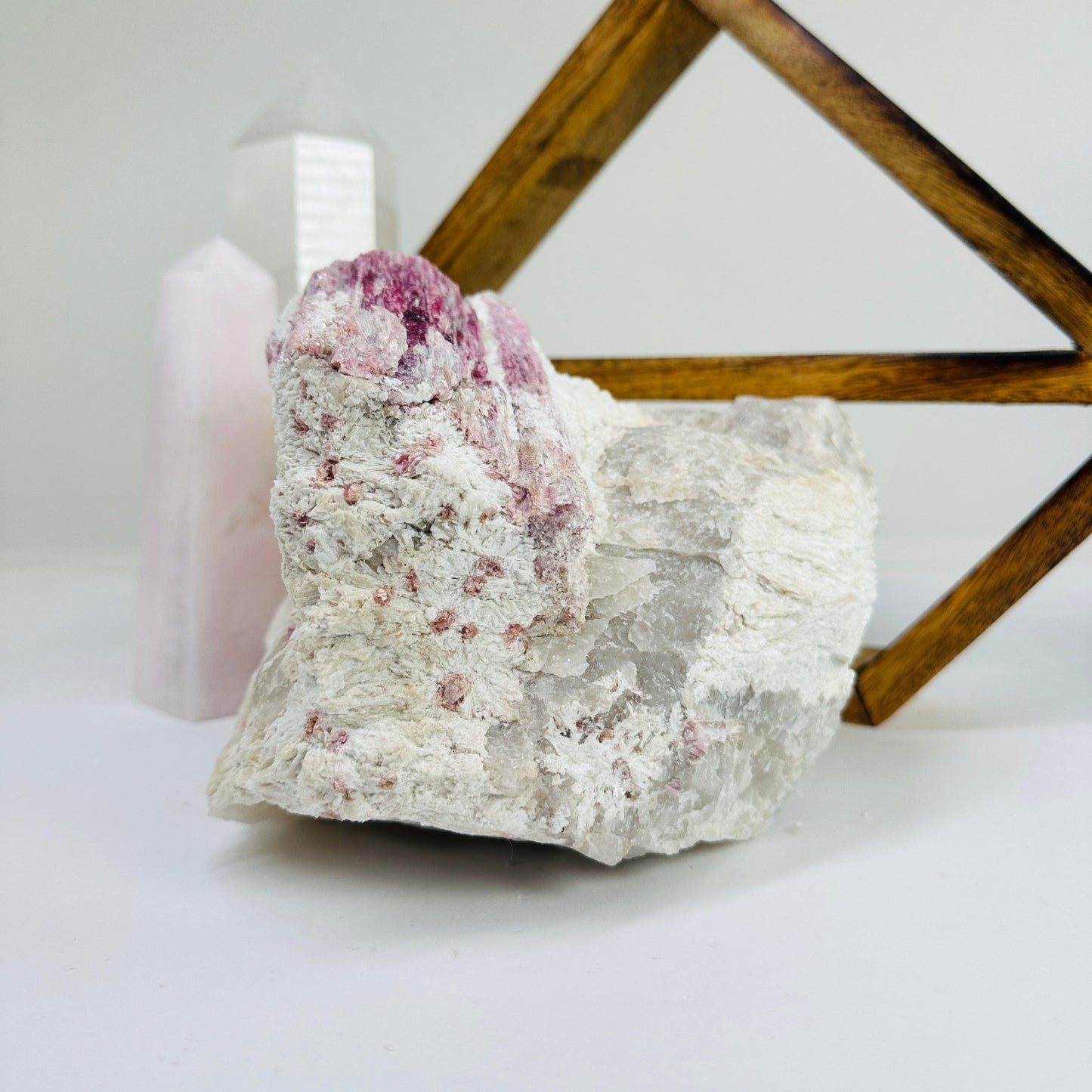 watermelon tourmaline with decorations in the background