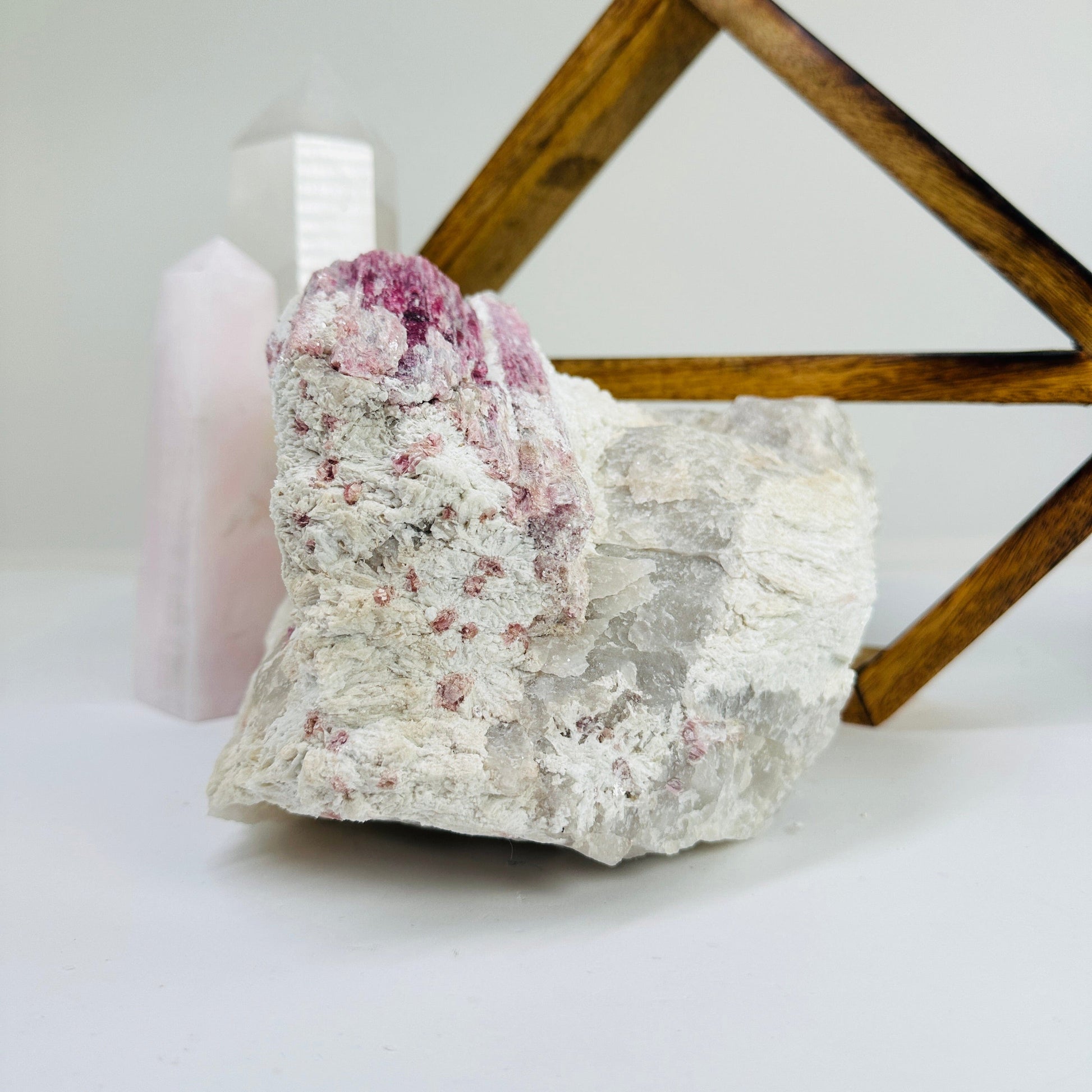 watermelon tourmaline with decorations in the background