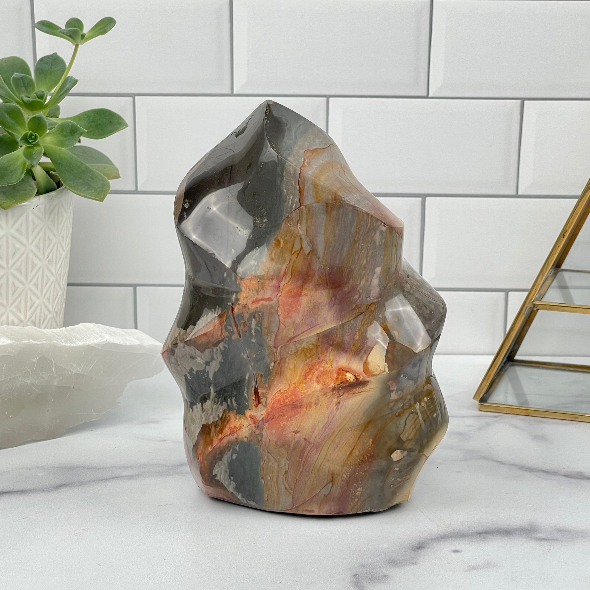Polychrome Jasper Polished Flame Point displayed as home decor 