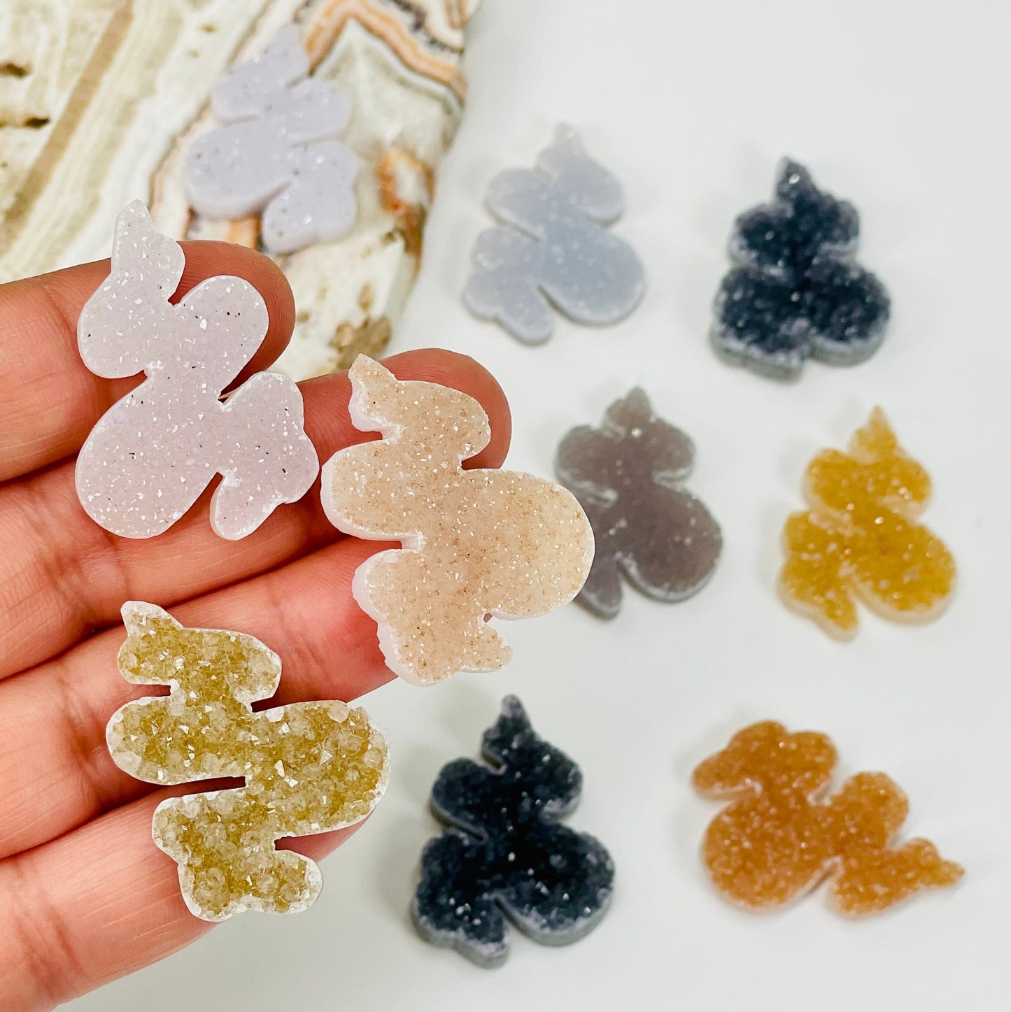 snake shaped druzy cabochons in hand for size reference 