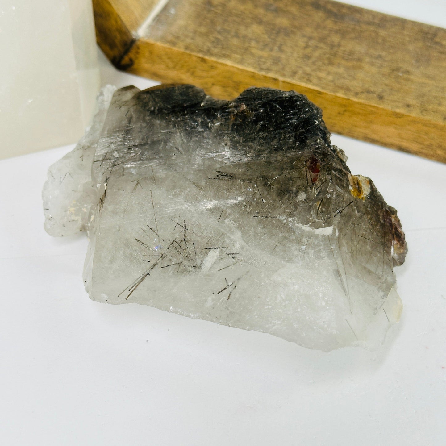 rutile quartz with decorations in the background