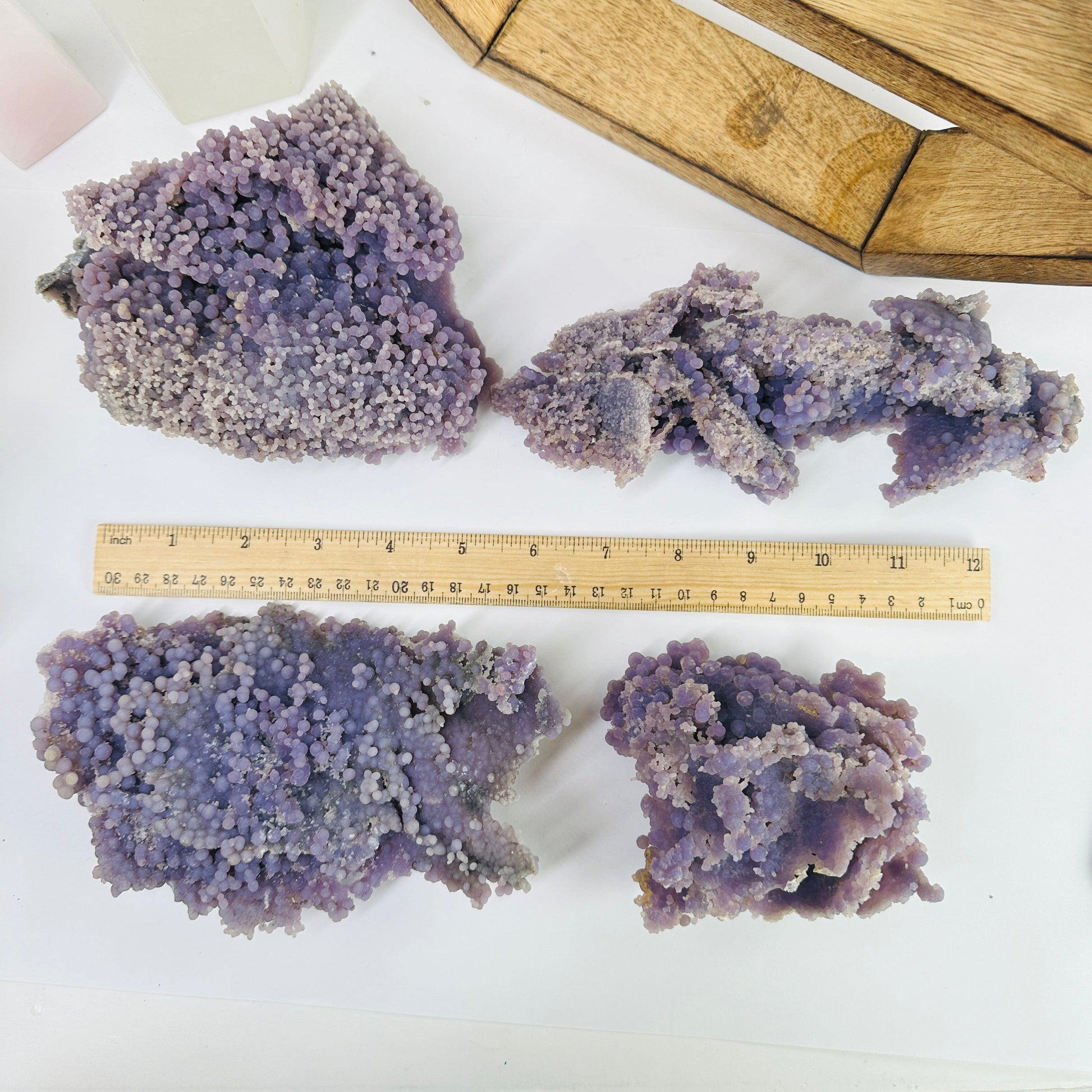 grape agate next to a ruler for size reference