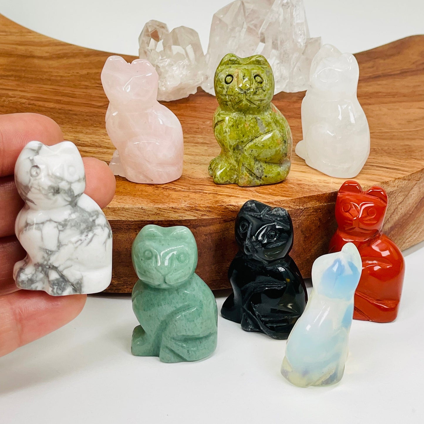 gemstone cat displayed in hand for size reference 