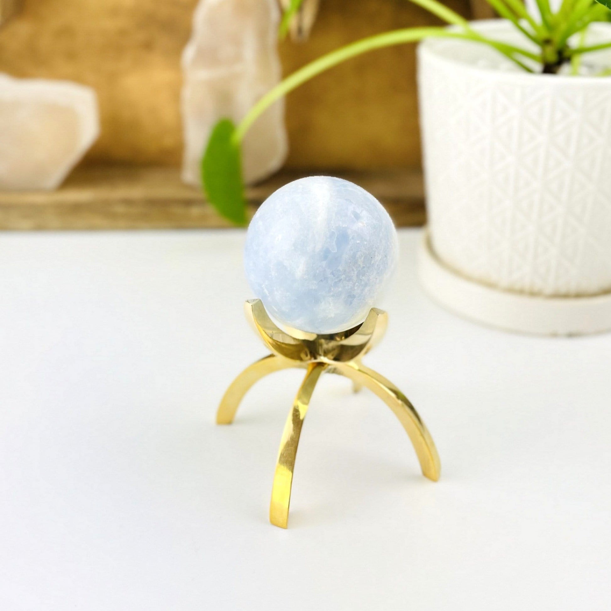 brass stand with a sphere