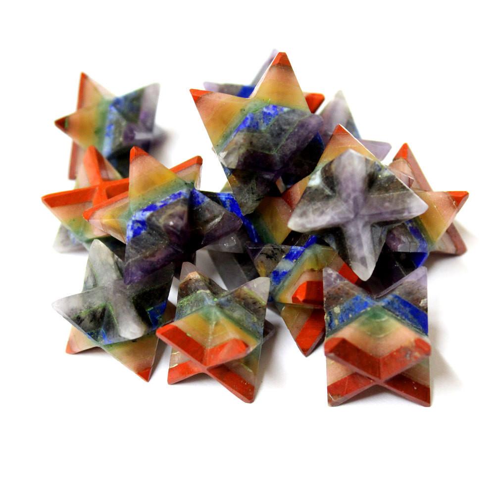 an assortment of seven chakra merka stars on a white background.